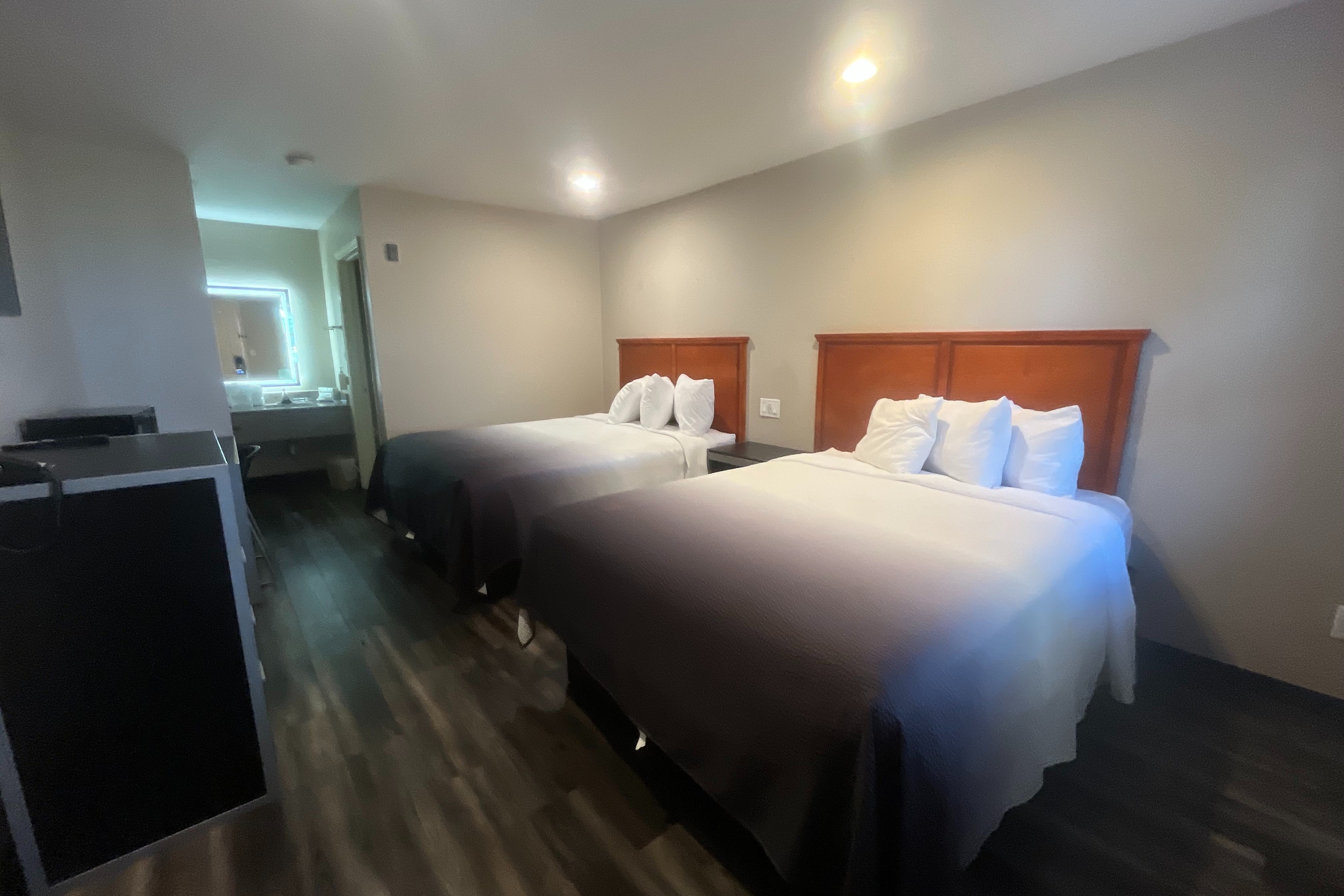 Guest room at the Super 8 by Wyndham Arlington Near AT&T Stadium in Arlington, Texas