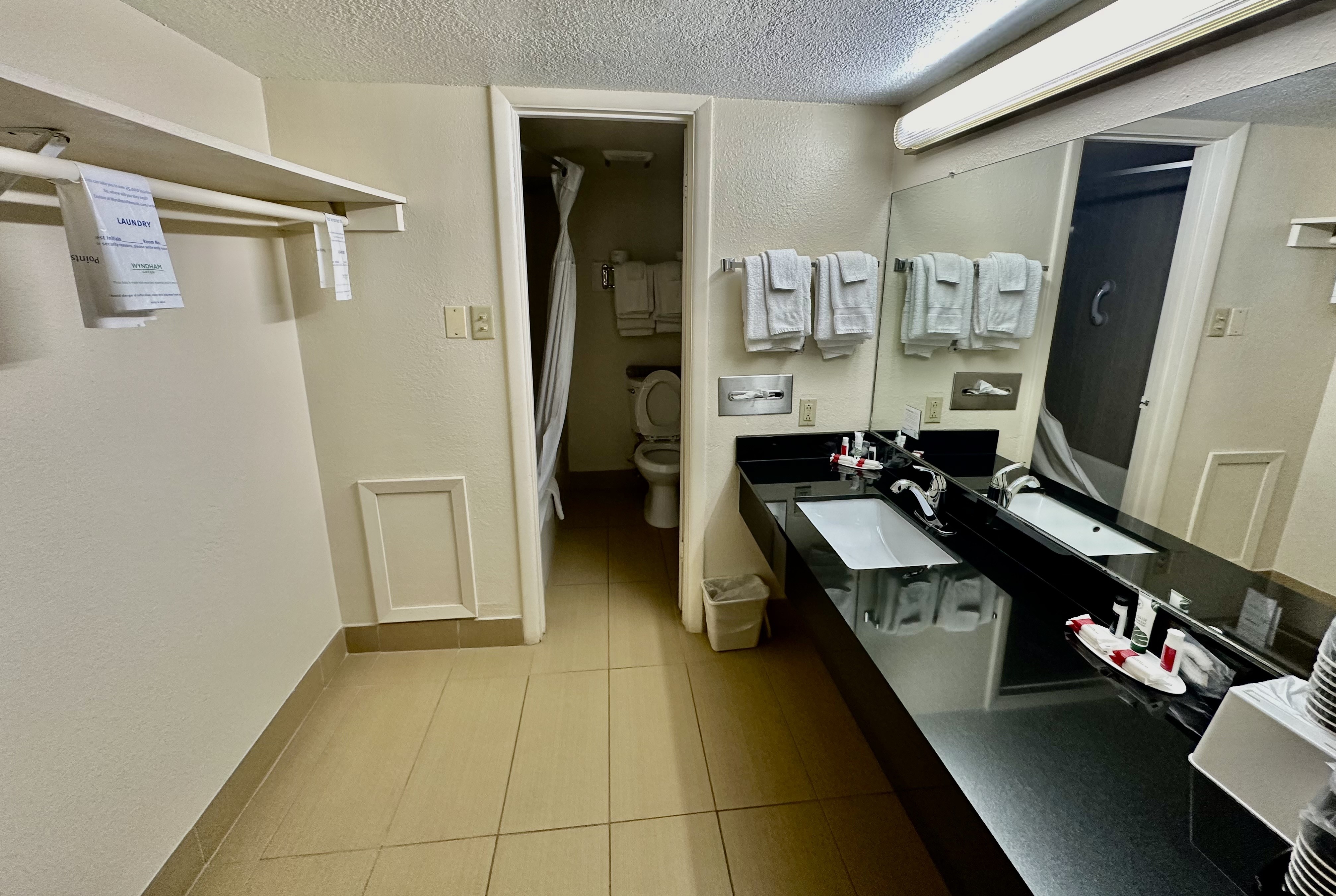 Guest room bath at the Super 8 by Wyndham Athens TX in Athens, Texas