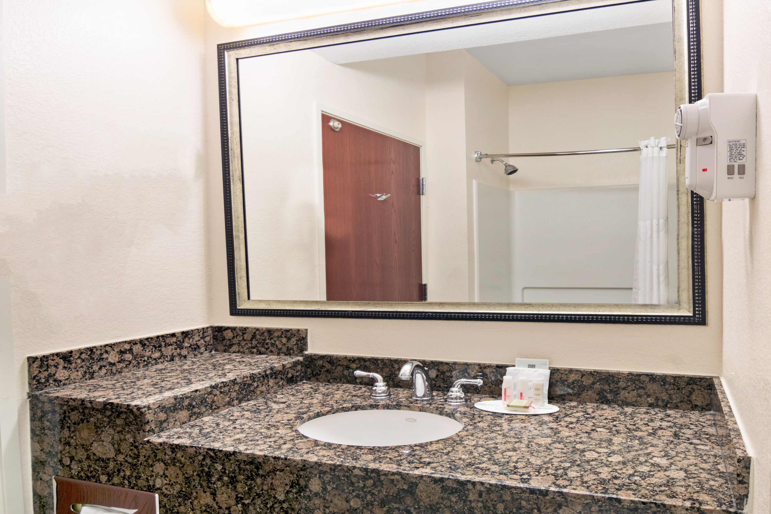 Guest room at the Super 8 by Wyndham Austin/Airport South in Austin, Texas