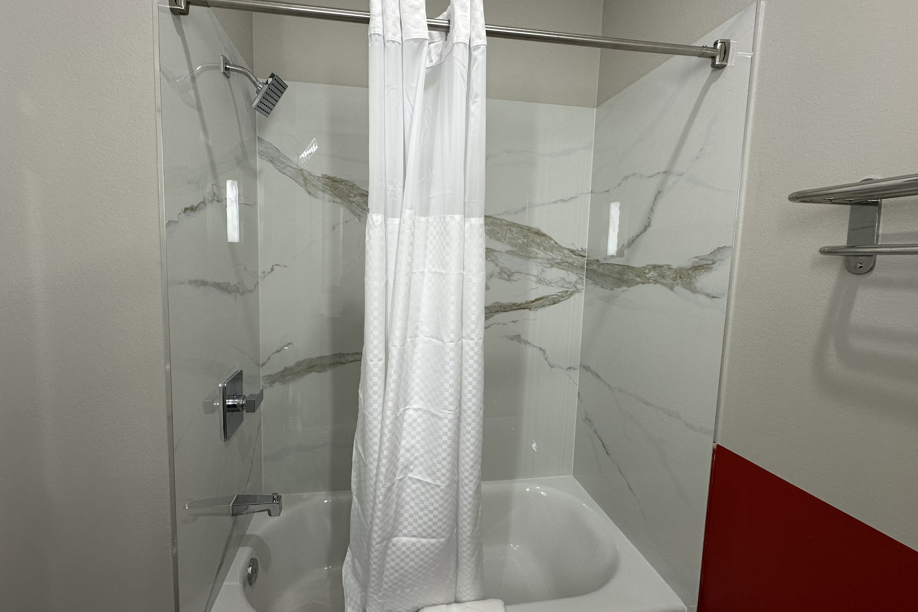 Guest room bath at the Super 8 by Wyndham Baytown in Baytown, Texas