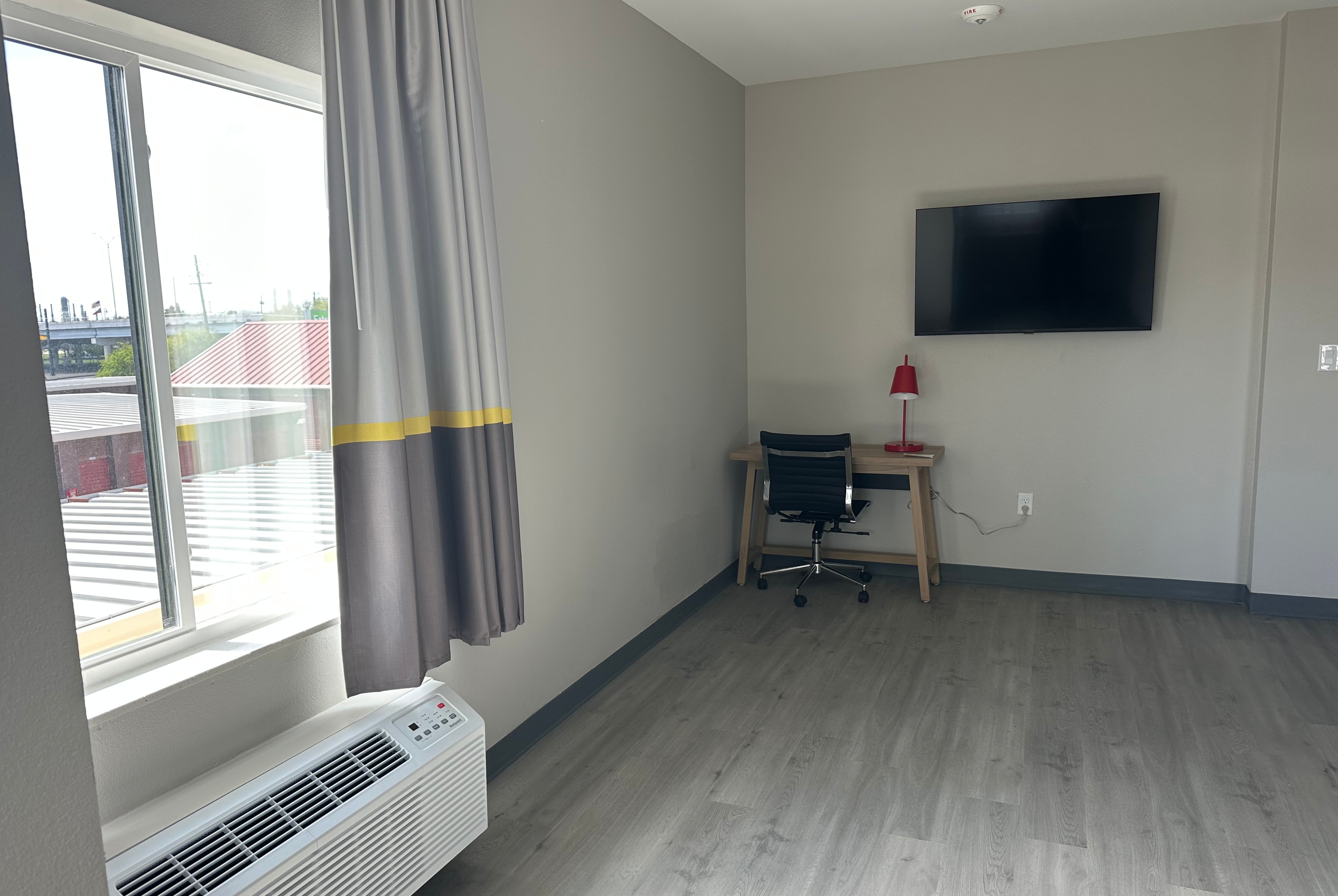 King bed guest room at the Super 8 by Wyndham Baytown in Baytown, Texas