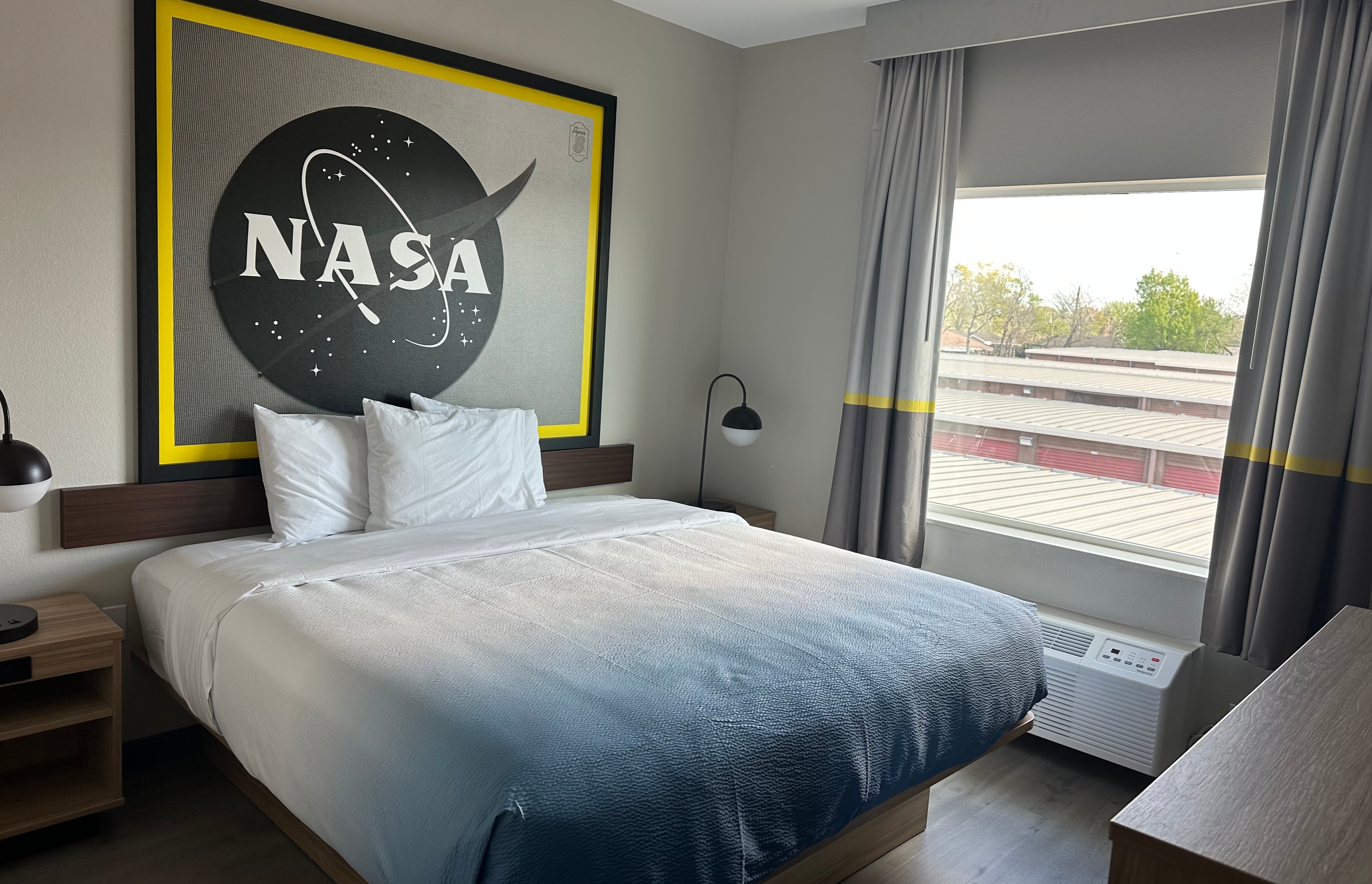 King bed guest room at the Super 8 by Wyndham Baytown in Baytown, Texas