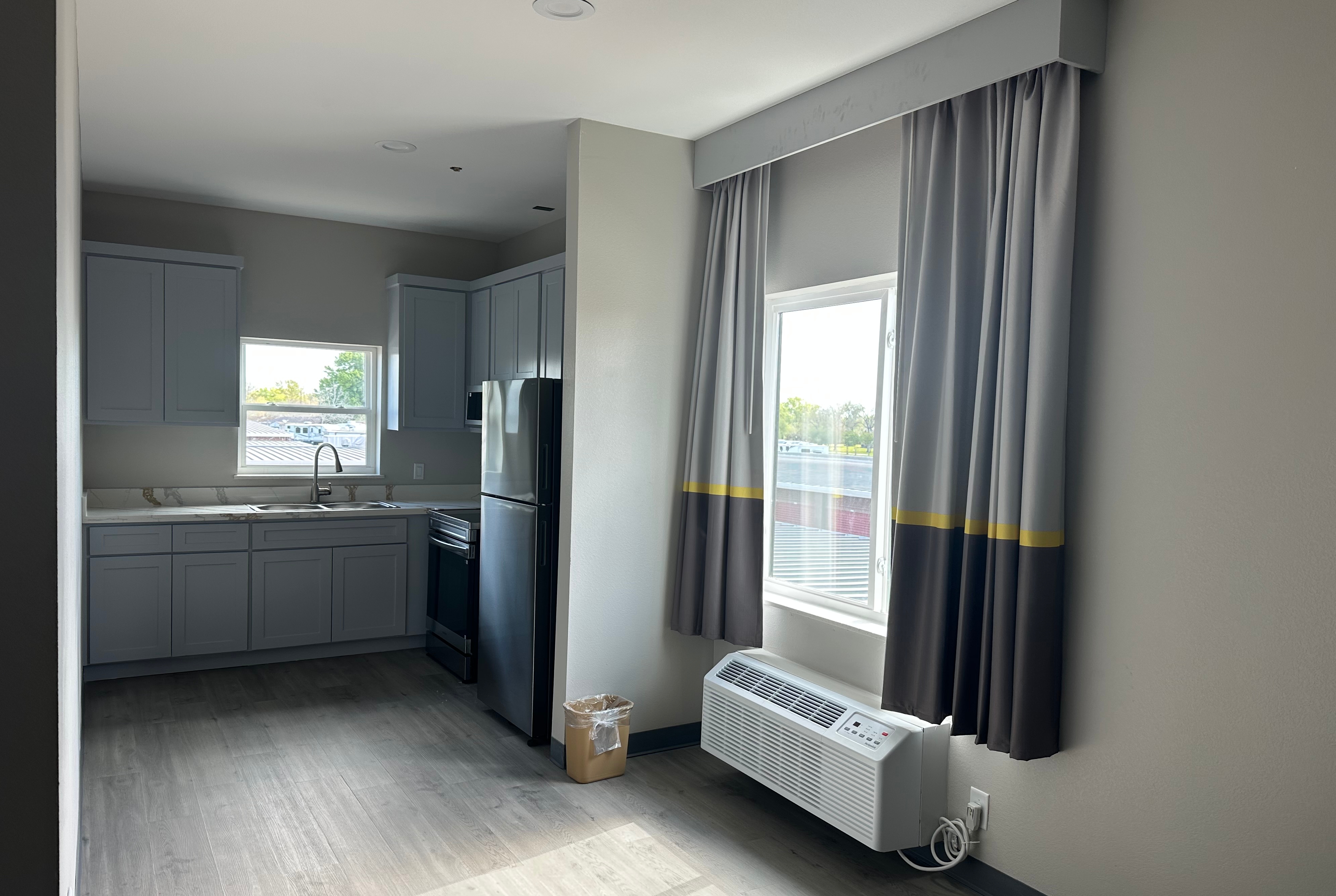 King bed guest room at the Super 8 by Wyndham Baytown in Baytown, Texas