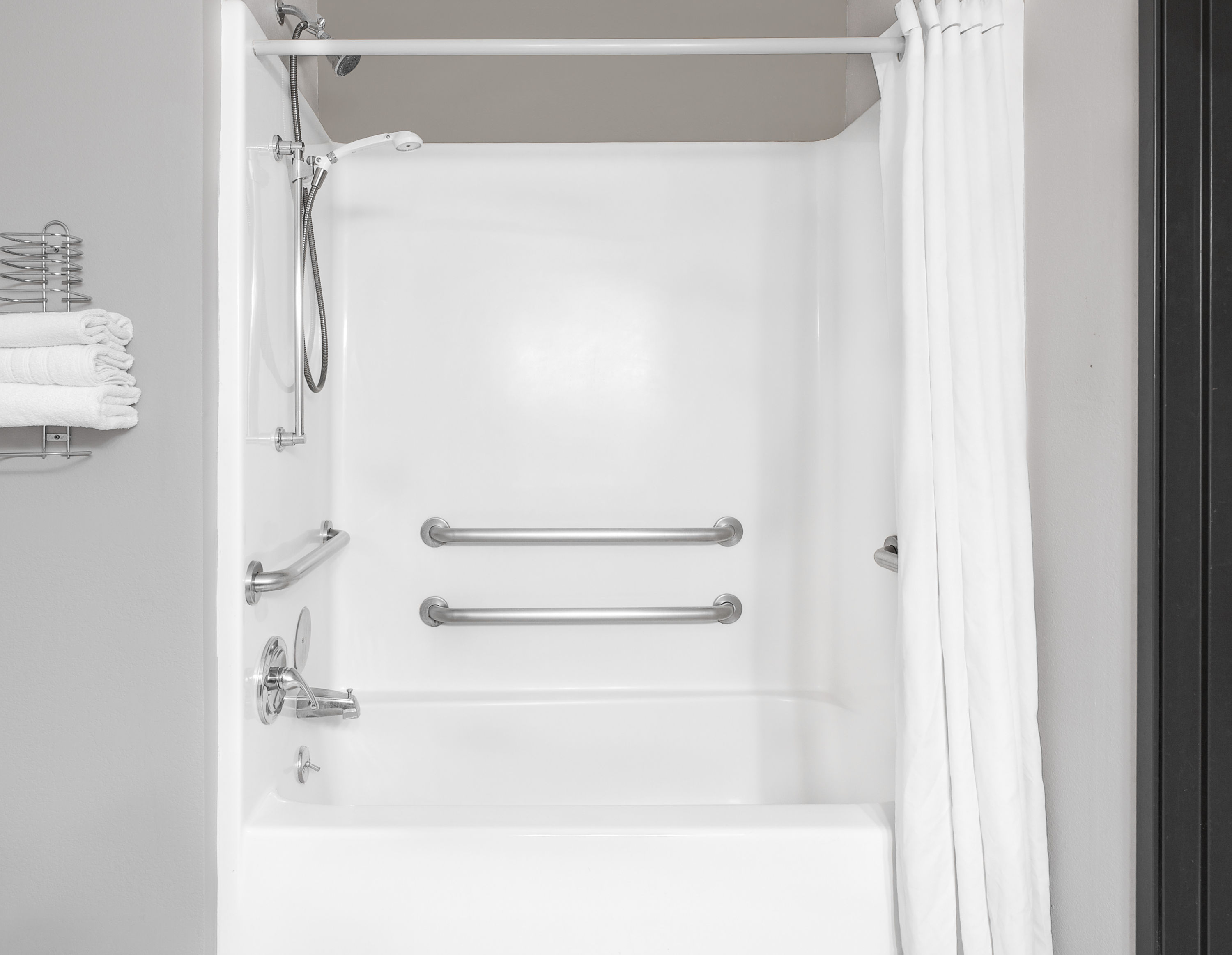 Guest room bath at the Super 8 by Wyndham Bedford DFW Airport West in Bedford, Texas