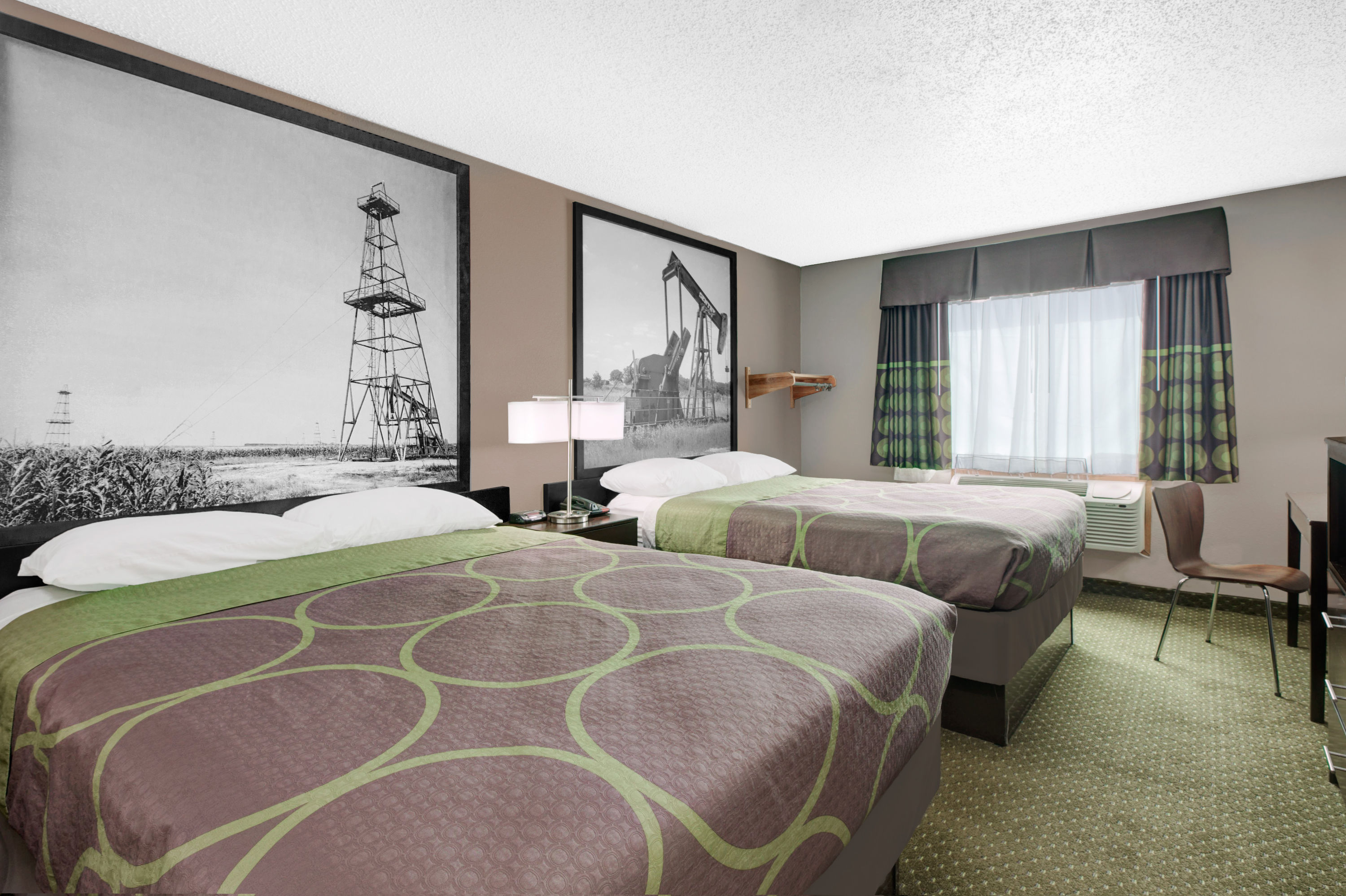 Guest room at the Super 8 by Wyndham Bedford DFW Airport West in Bedford, Texas