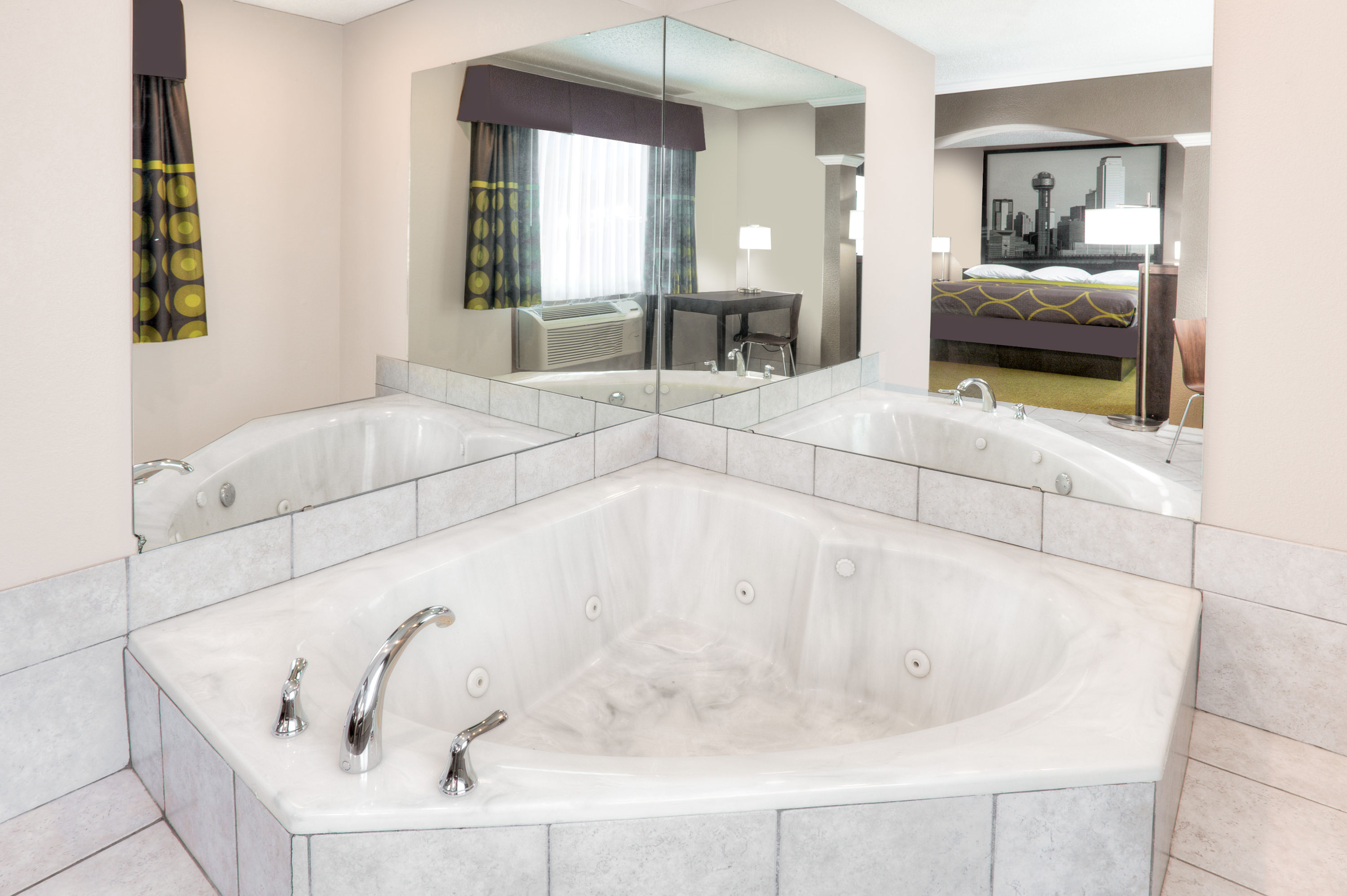 Guest room bath at the Super 8 by Wyndham Bedford DFW Airport West in Bedford, Texas