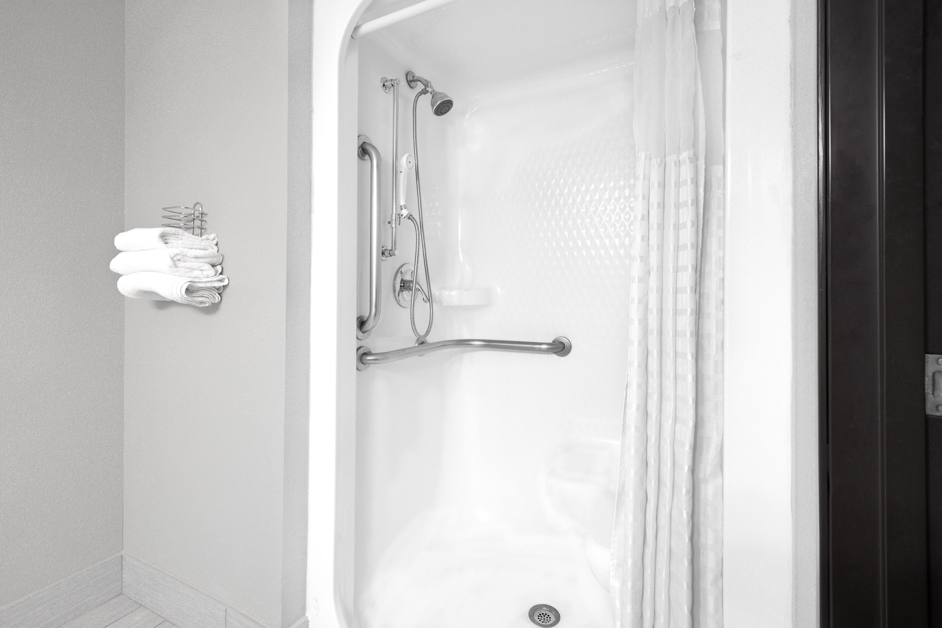 Guest room bath at the Super 8 by Wyndham Bedford DFW Airport West in Bedford, Texas