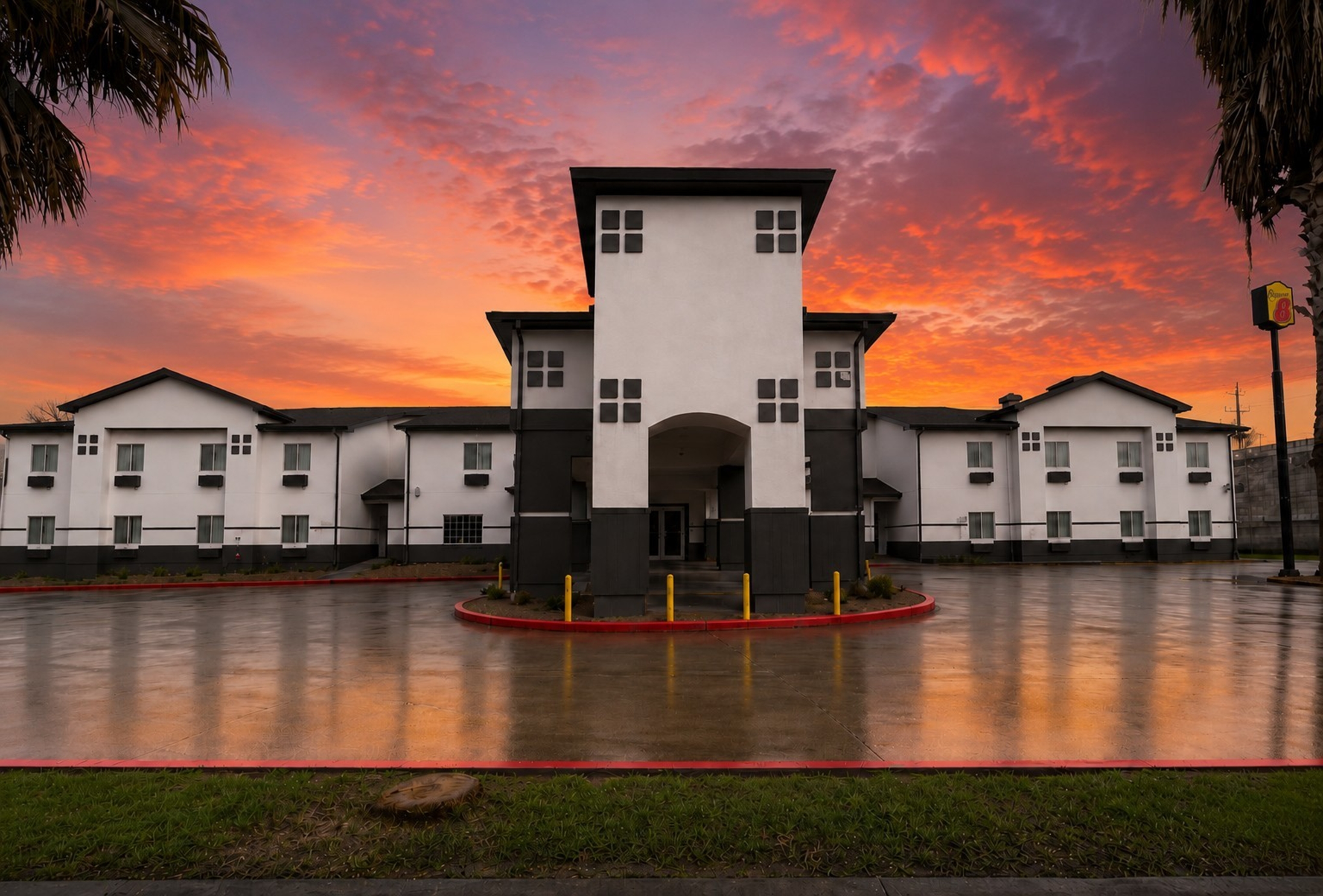Exterior Dusk Image of Super 8 by Wyndham Brenham TX hotel in Brenham, Texas