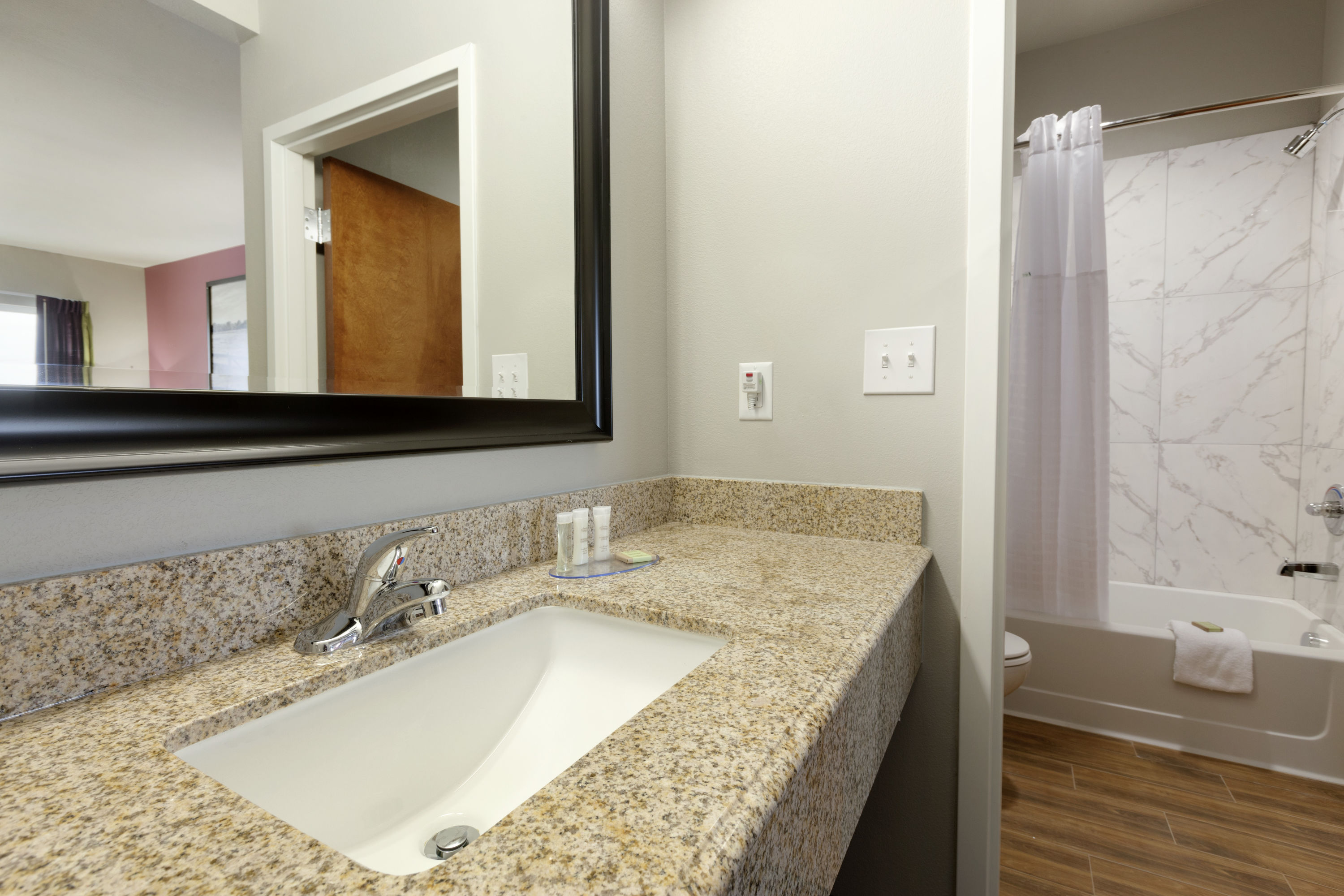 Guest room bath at the Super 8 by Wyndham Carrizo Springs in Carrizo Springs, Texas