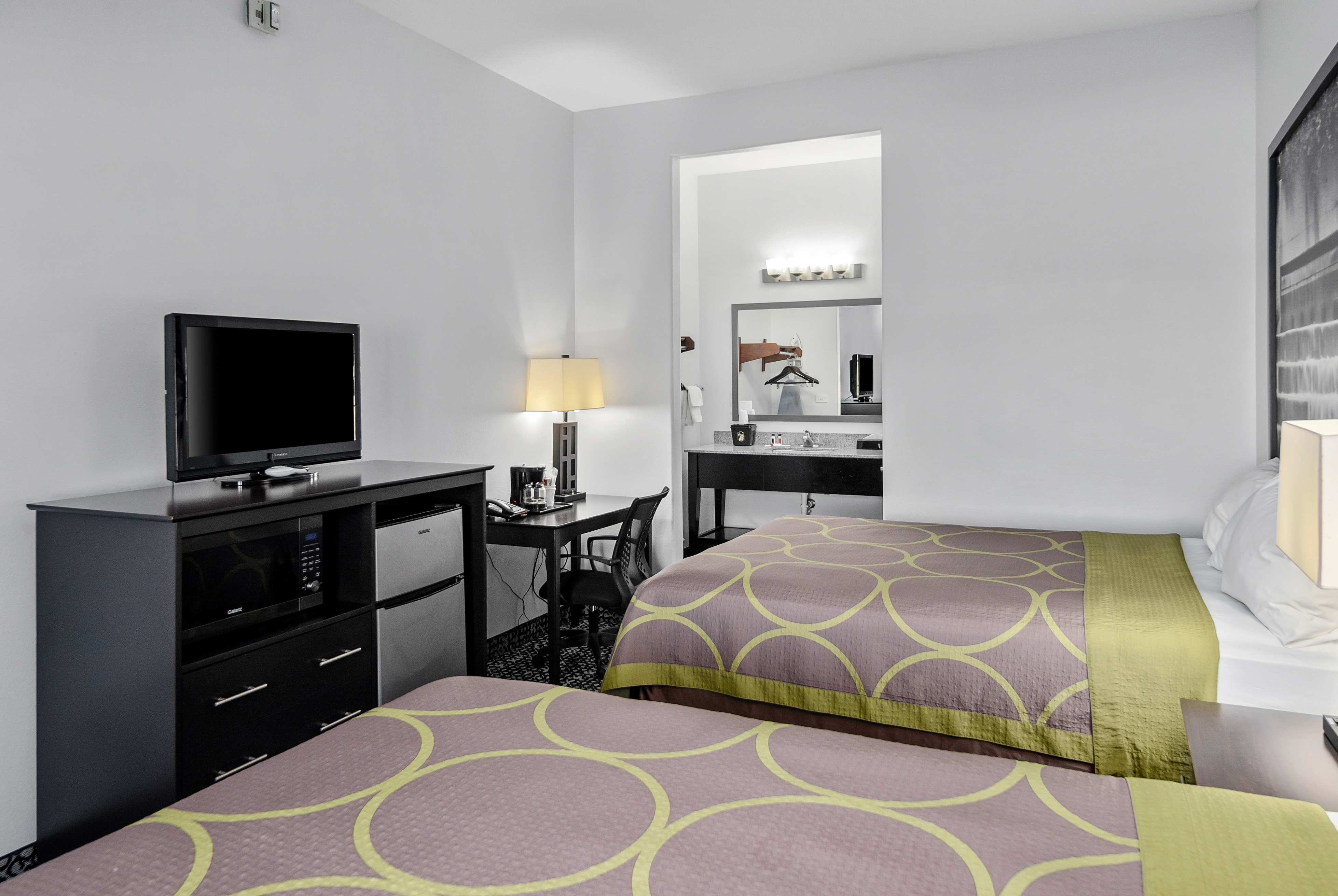 Guest room at the Super 8 by Wyndham Carthage TX in Carthage, Texas