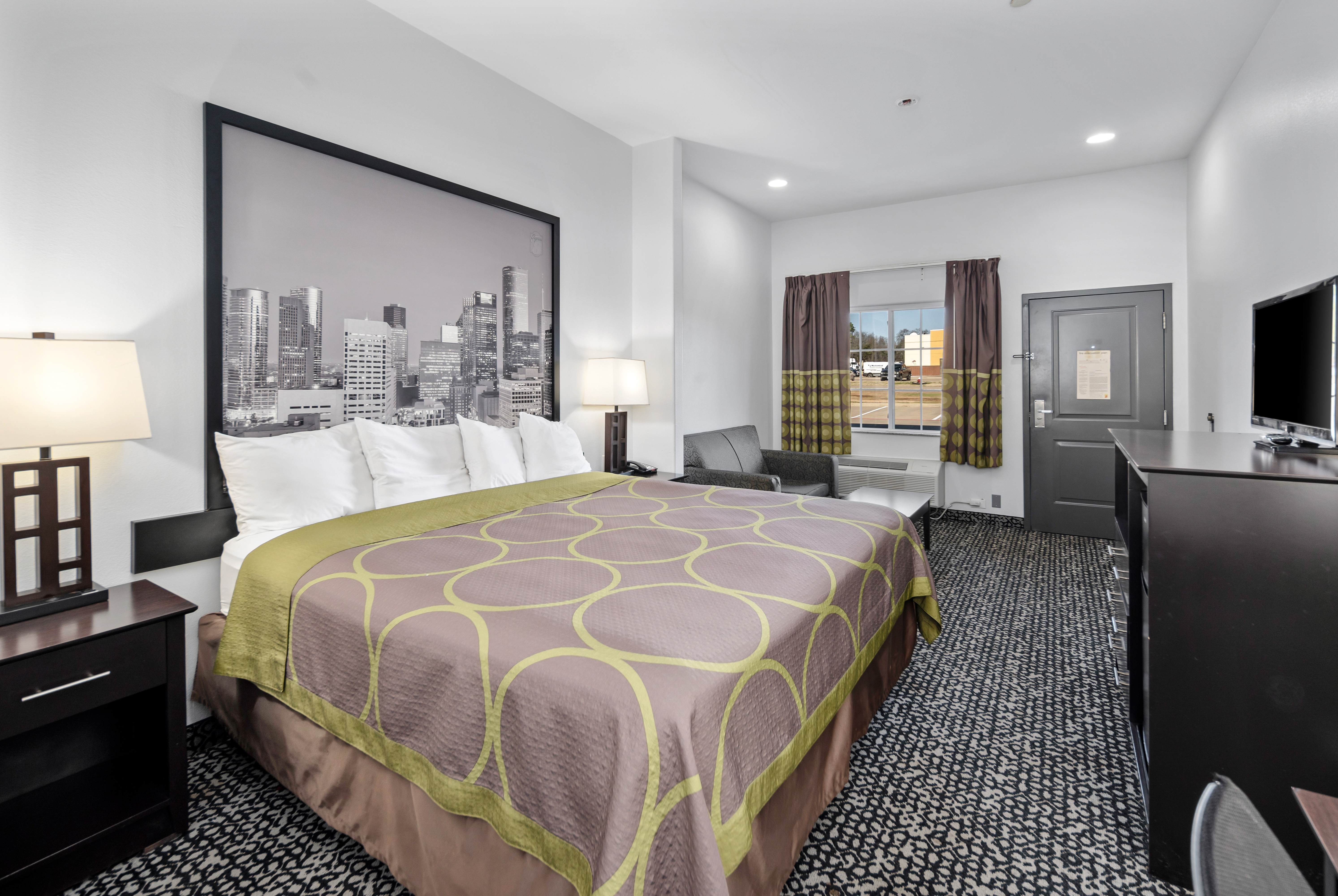 Guest room at the Super 8 by Wyndham Carthage TX in Carthage, Texas