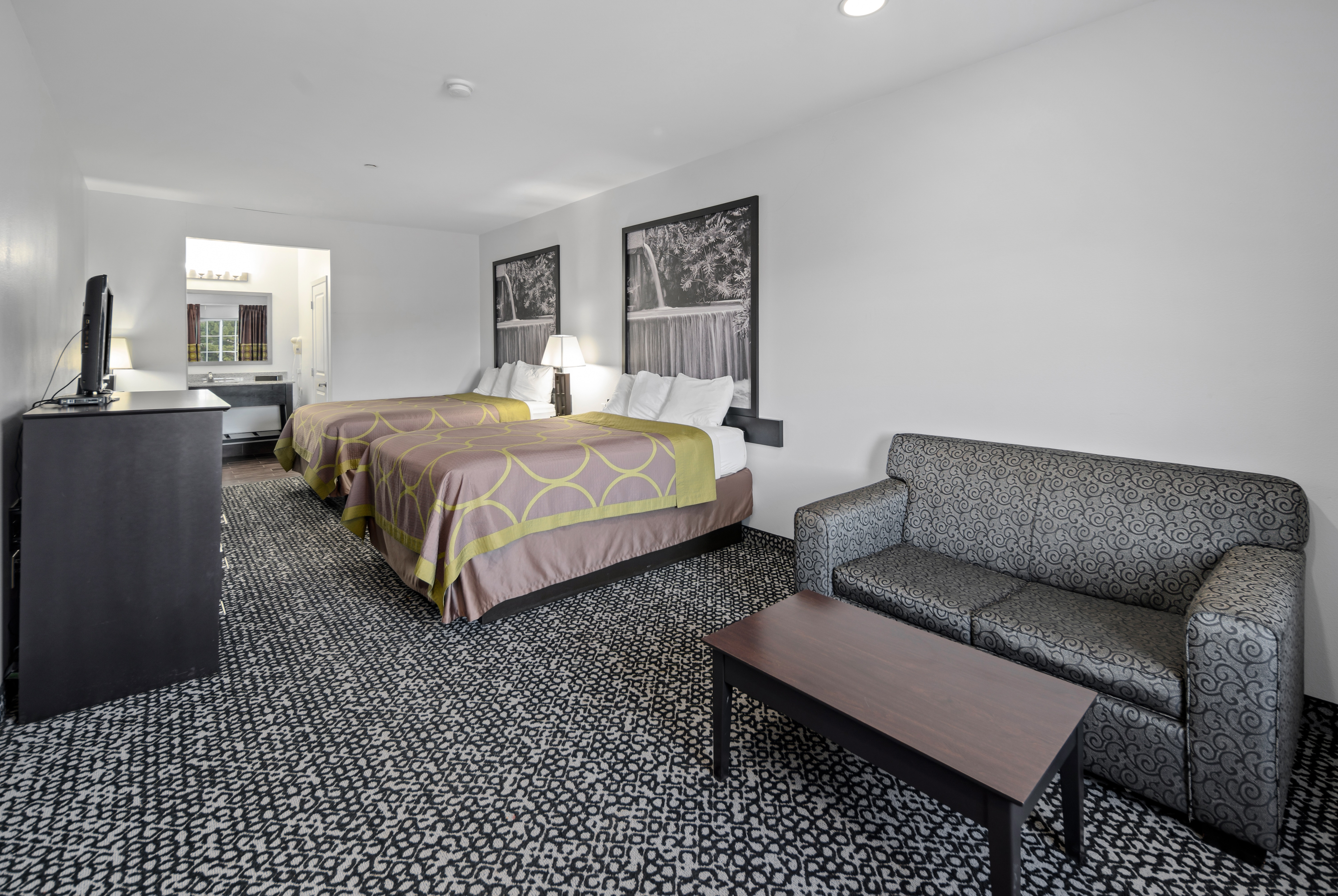 Guest room at the Super 8 by Wyndham Carthage TX in Carthage, Texas