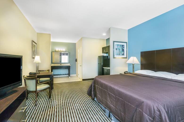 Guest room at the Super 8 Center in Center, Texas