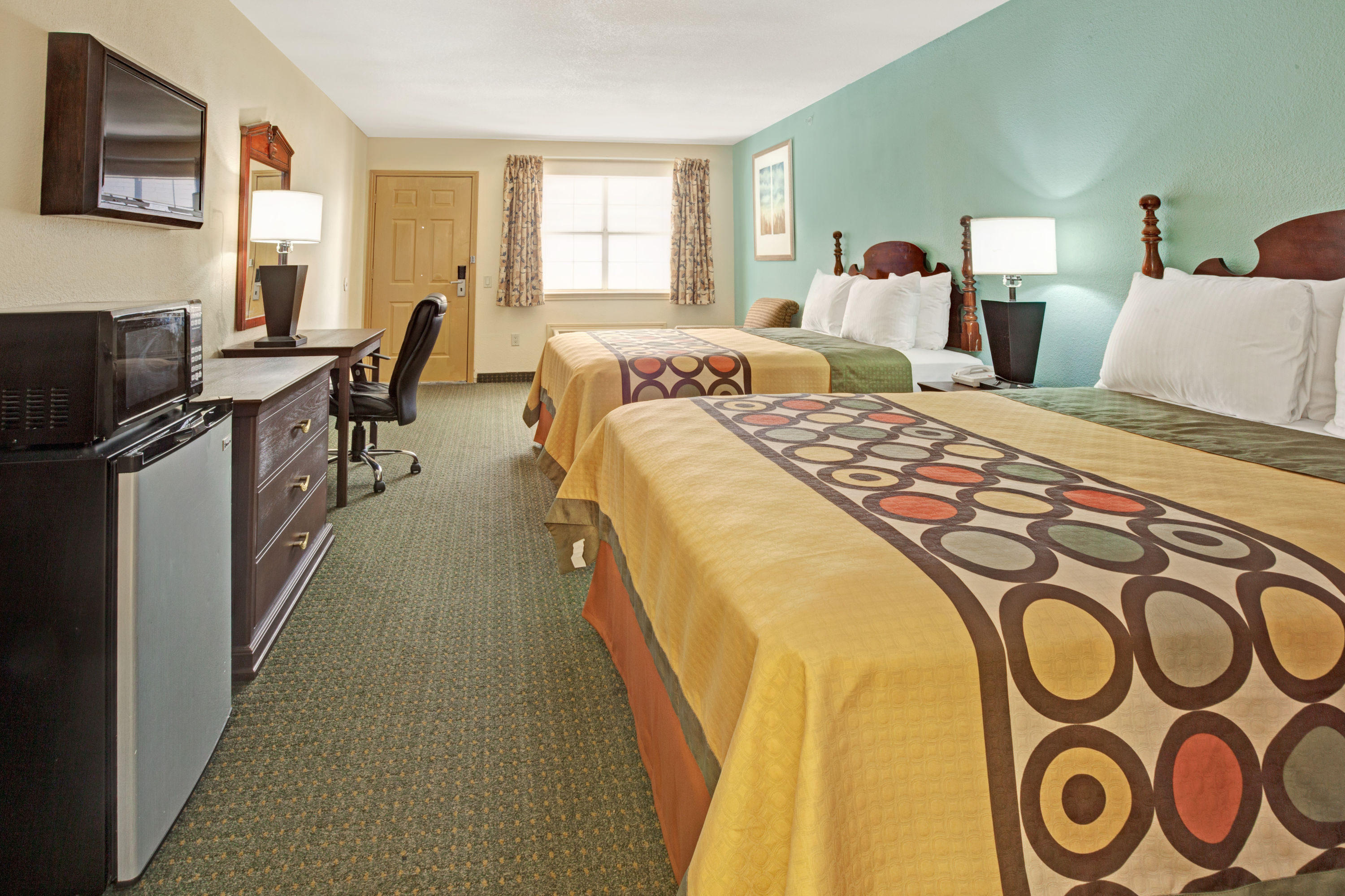 Guest room at the Super 8 by Wyndham Dallas East Near Fair Park/Downtown in Dallas, Texas