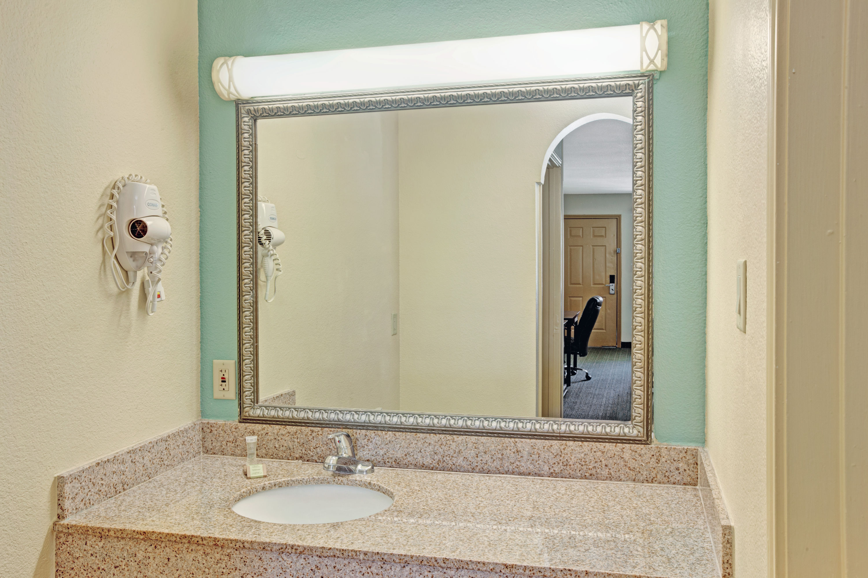 Guest room at the Super 8 by Wyndham Dallas East Near Fair Park/Downtown in Dallas, Texas