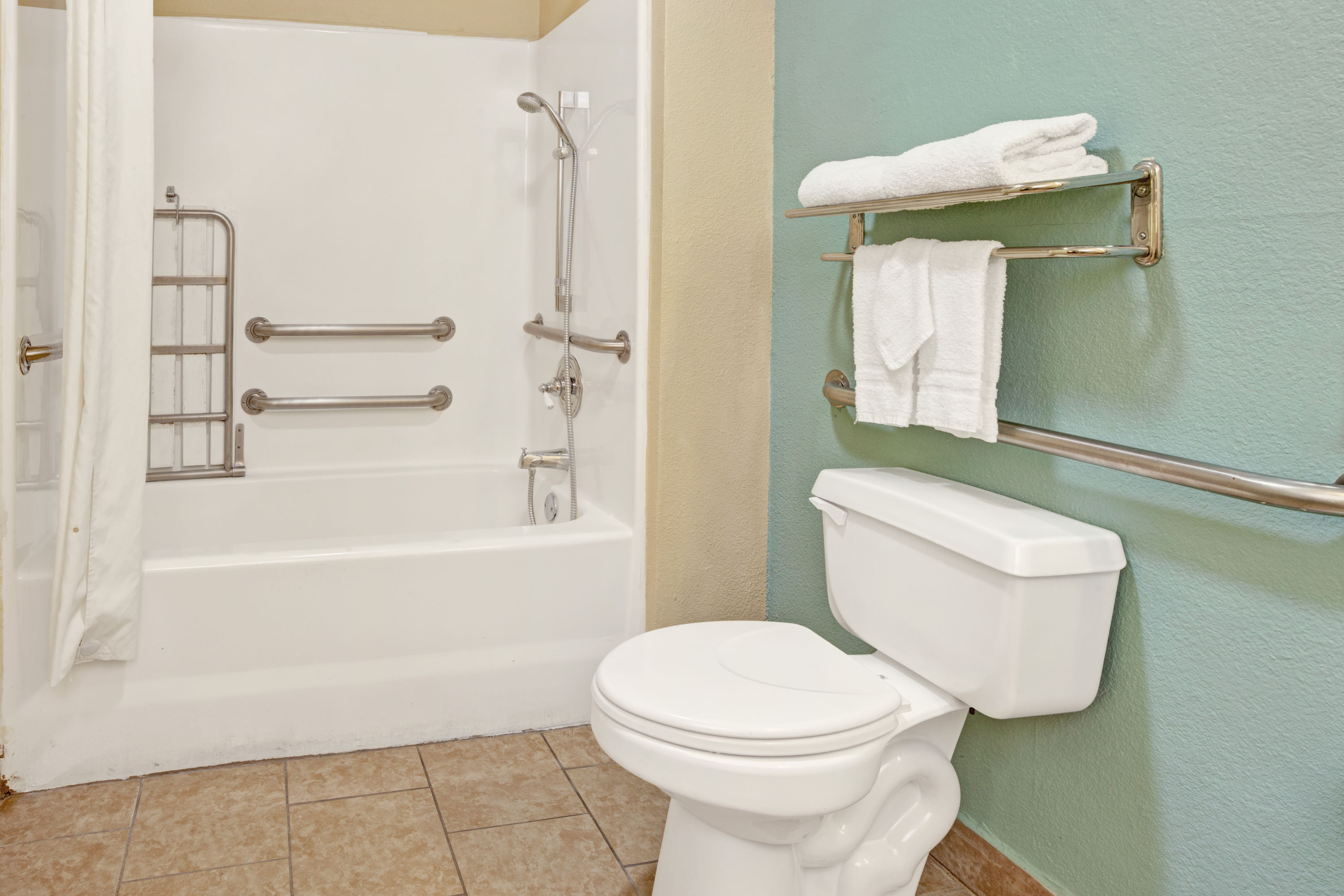 Guest room at the Super 8 by Wyndham Dallas East Near Fair Park/Downtown in Dallas, Texas