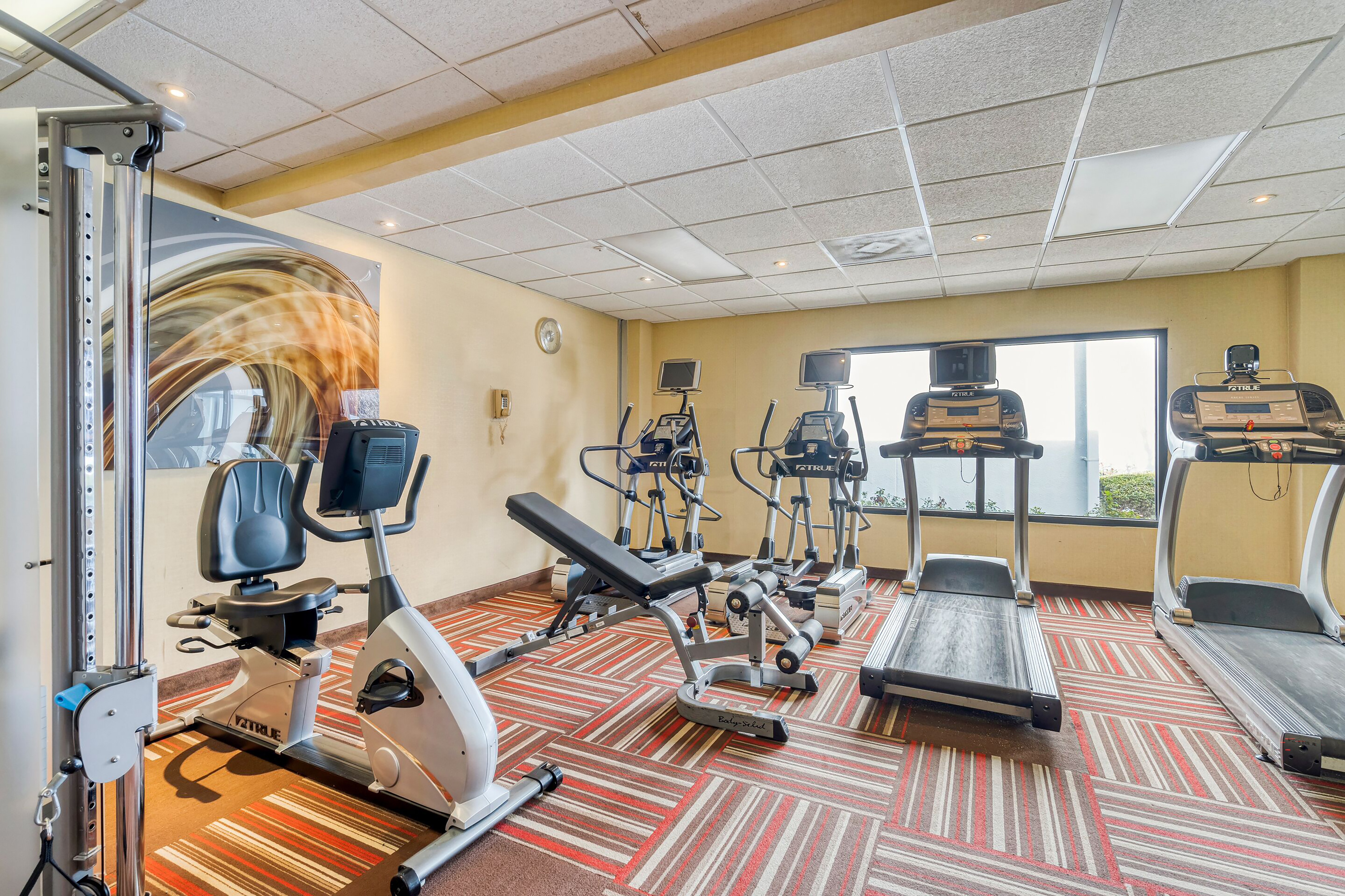 Fitness room at Super 8 by Wyndham Dallas Love Field Airport in Dallas, Texas