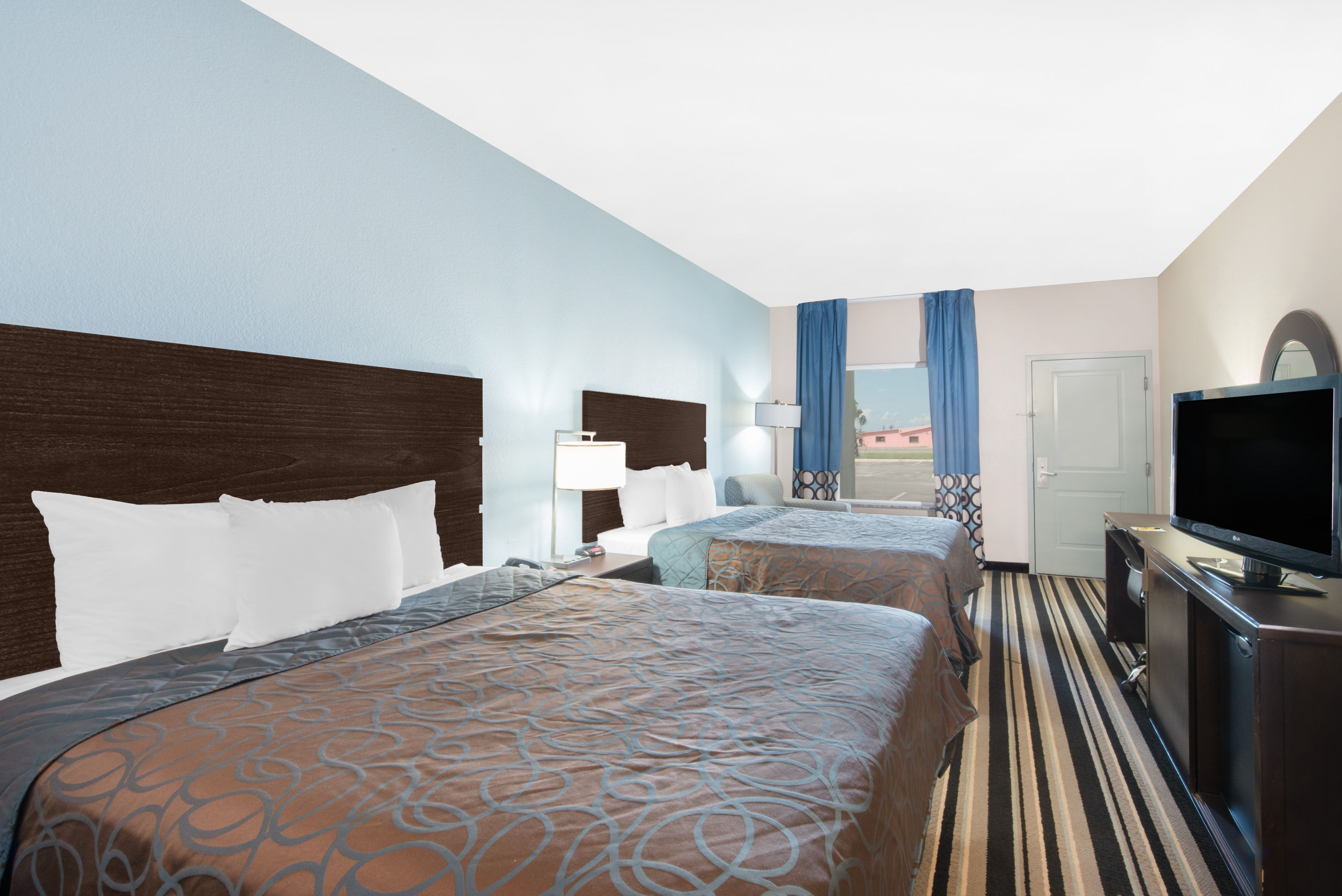 Guest room at the Super 8 by Wyndham Dilley TX in Dilley, Texas