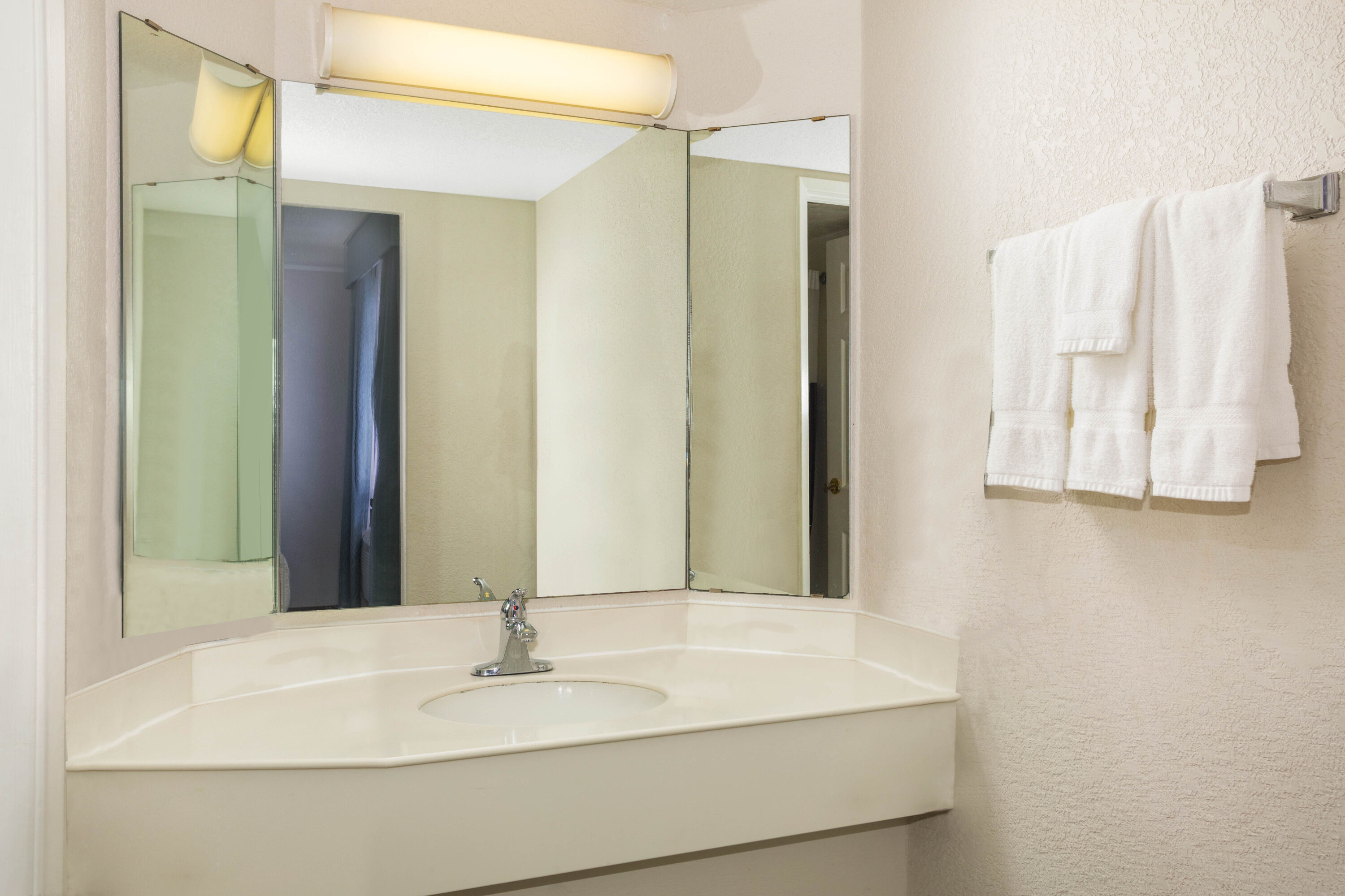 Guest room bath at the Super 8 by Wyndham Eagle Pass in Eagle Pass, Texas