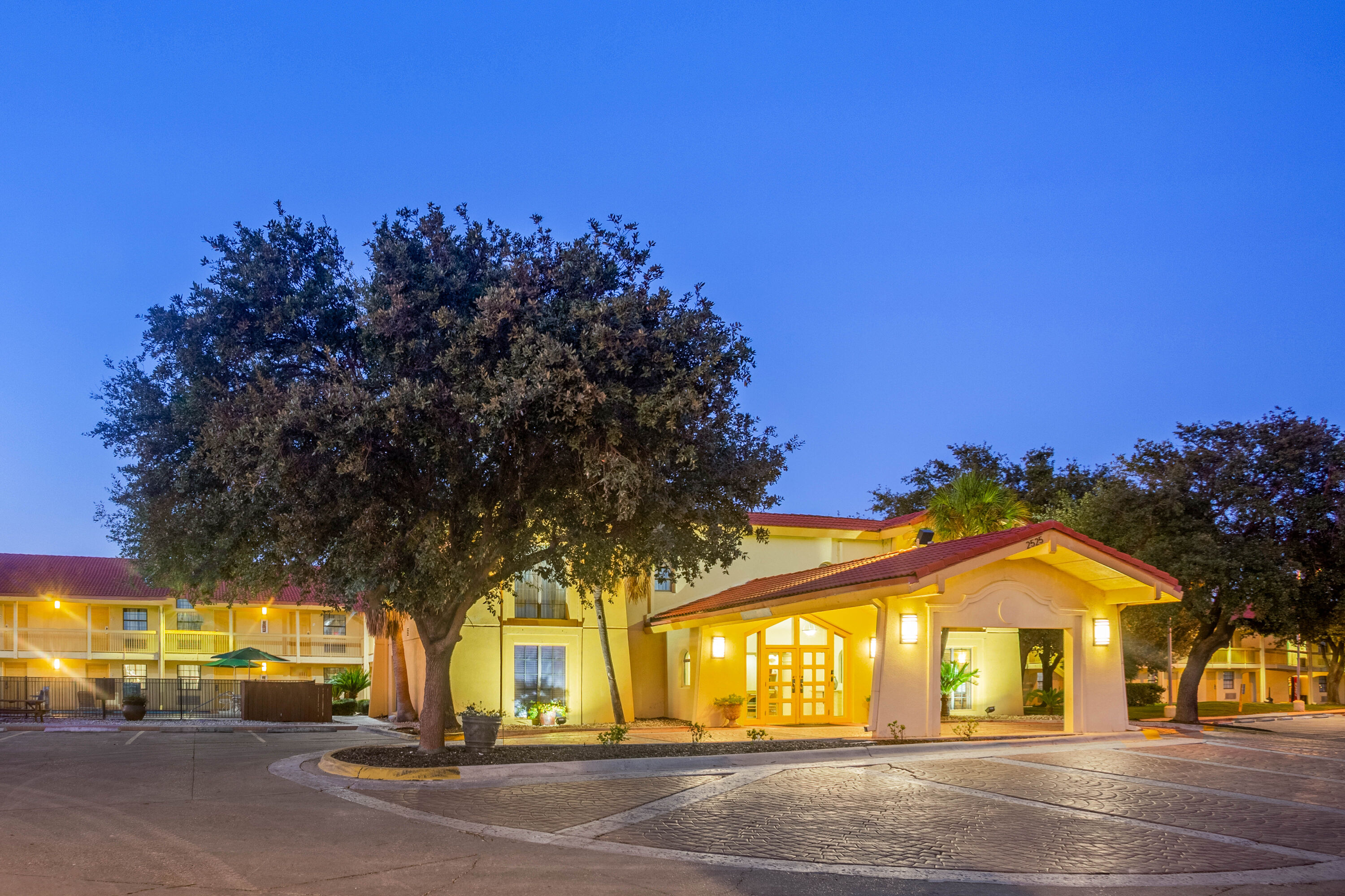 Exterior Dusk Image of Super 8 by Wyndham Eagle Pass hotel in Eagle Pass, Texas