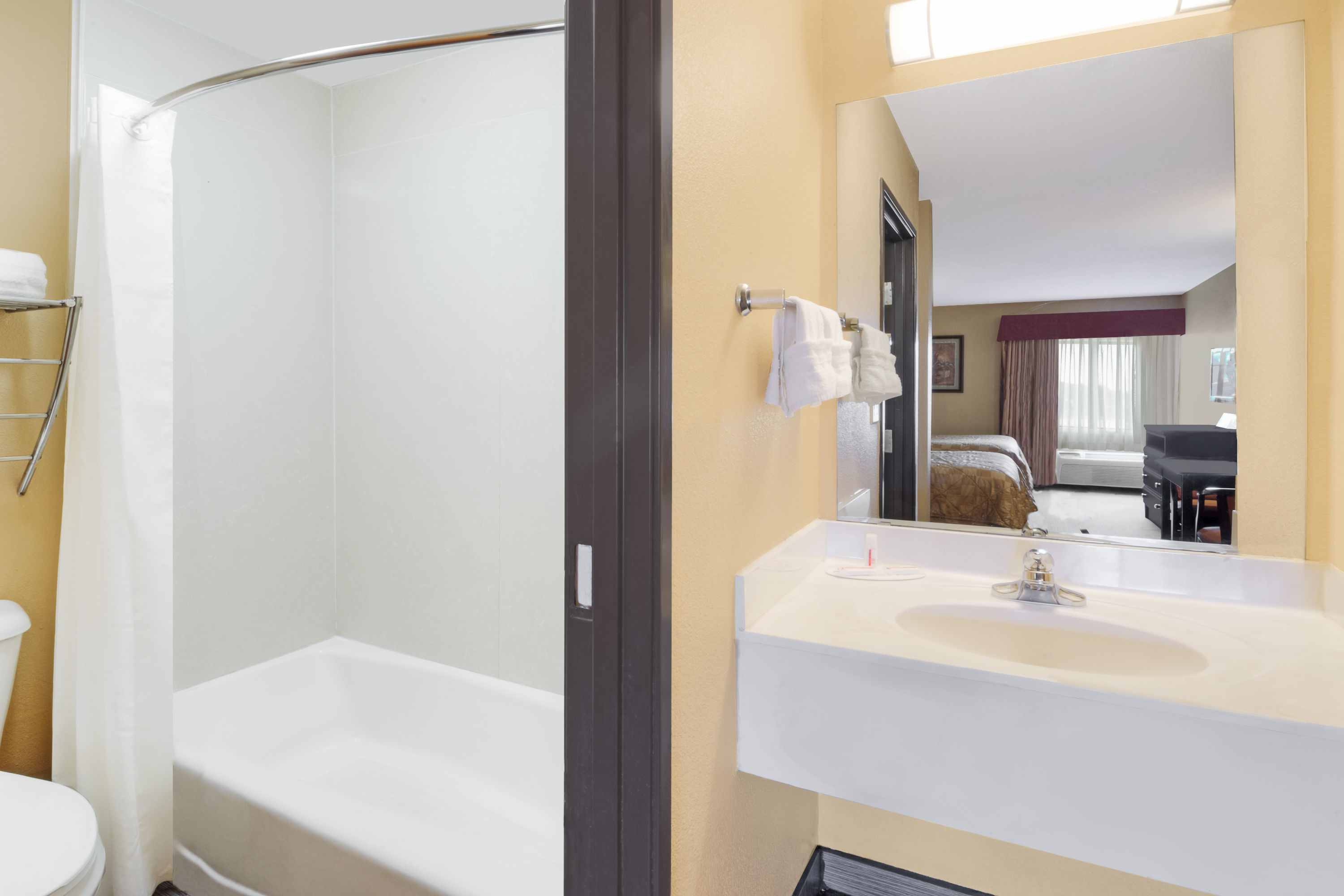 Guest room bath at the Super 8 by Wyndham Farmers Branch/North Dallas in Farmers Branch, Texas