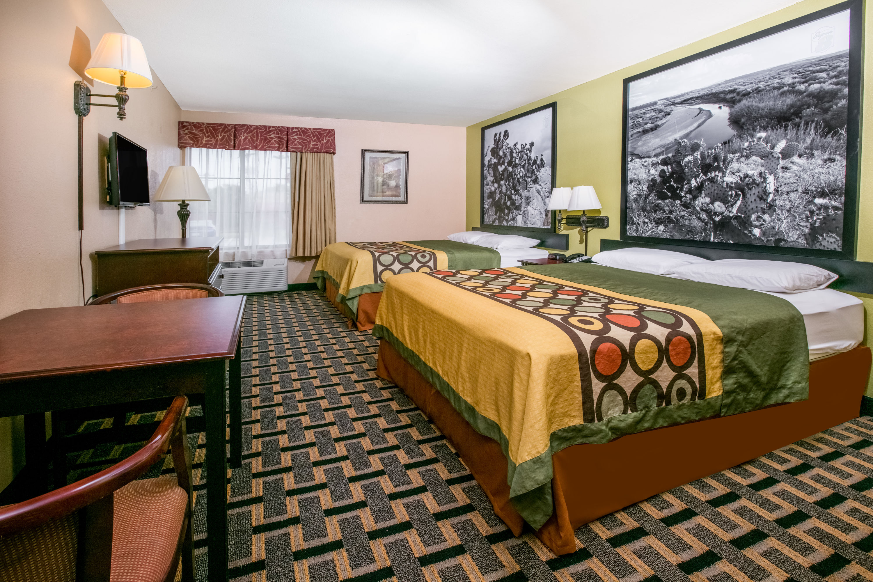 Guest room at the Super 8 by Wyndham Farmers Branch/North Dallas in Farmers Branch, Texas