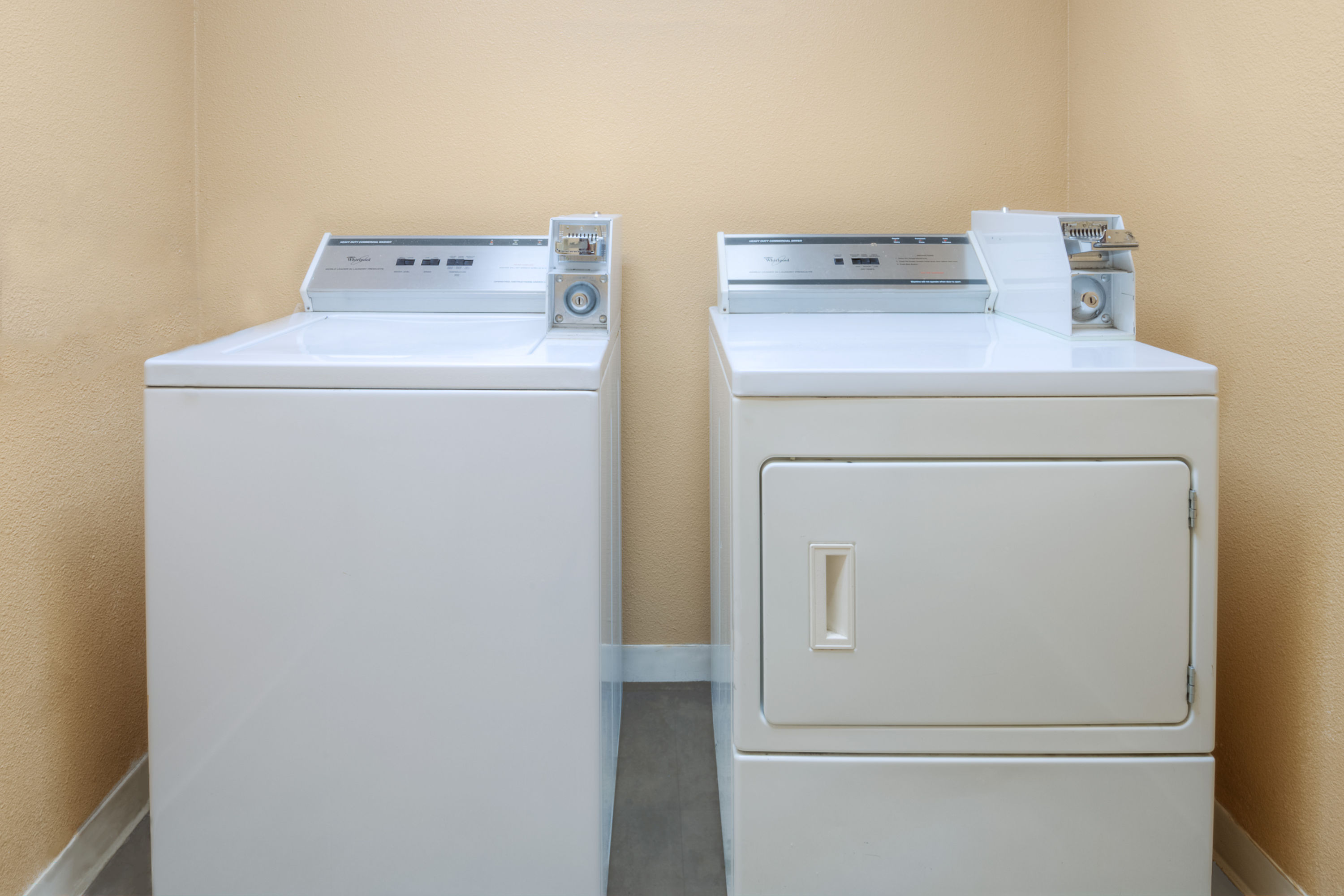Laundry facilities at Super 8 by Wyndham Farmers Branch/North Dallas in Farmers Branch, Texas