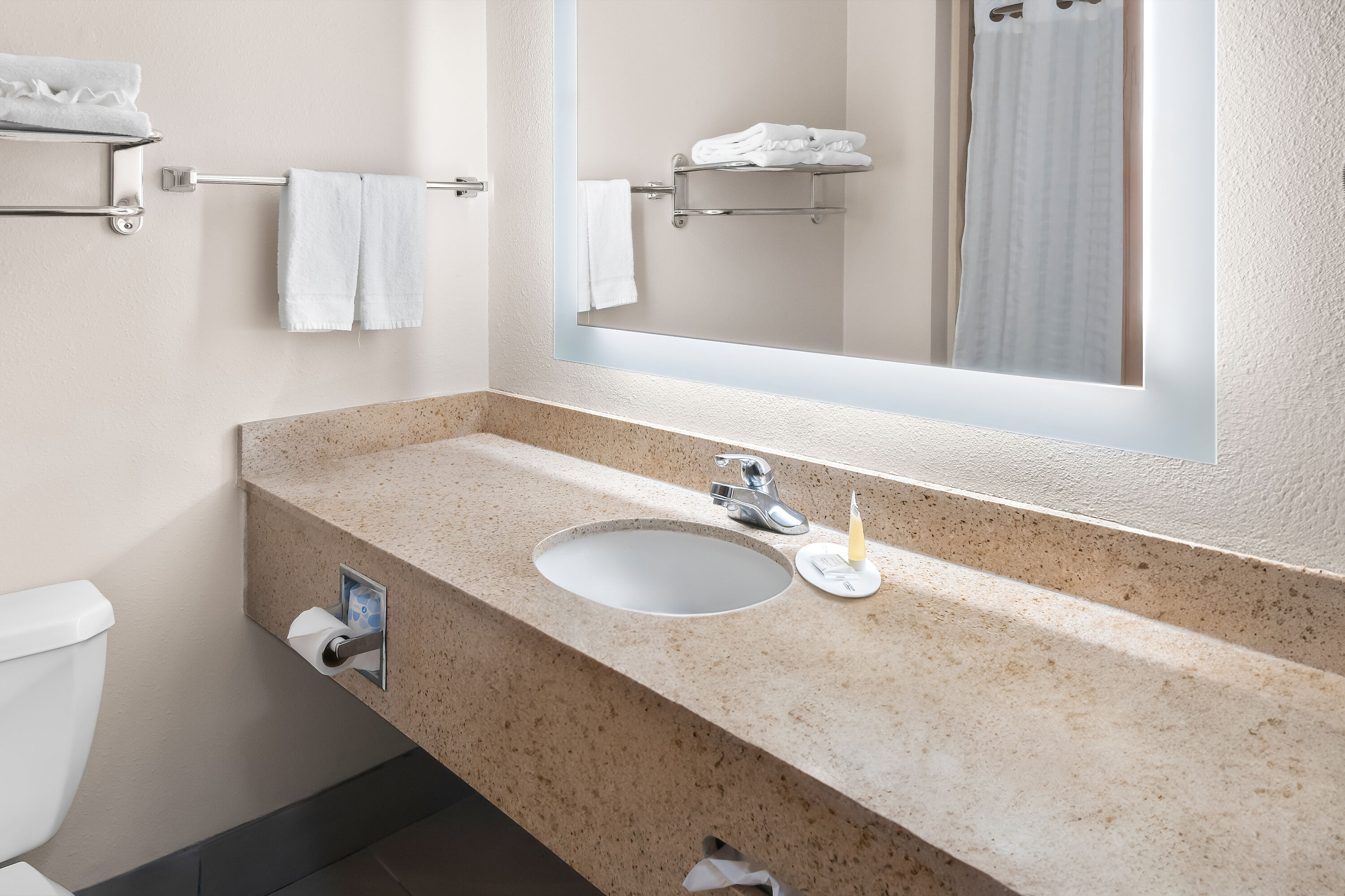 Guest room bath at the Super 8 by Wyndham Fort Worth Stockyards in Fort Worth, Texas