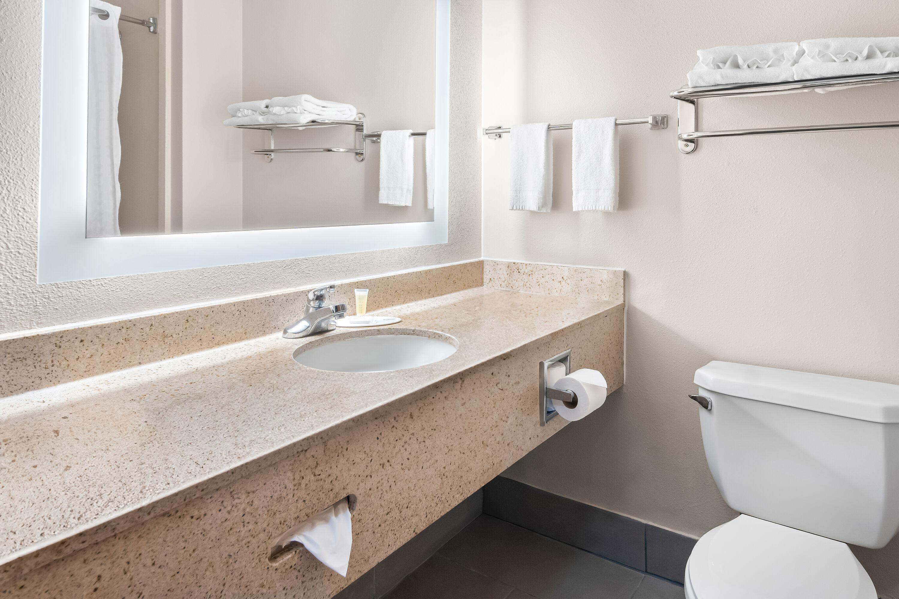 Guest room bath at the Super 8 by Wyndham Fort Worth Stockyards in Fort Worth, Texas