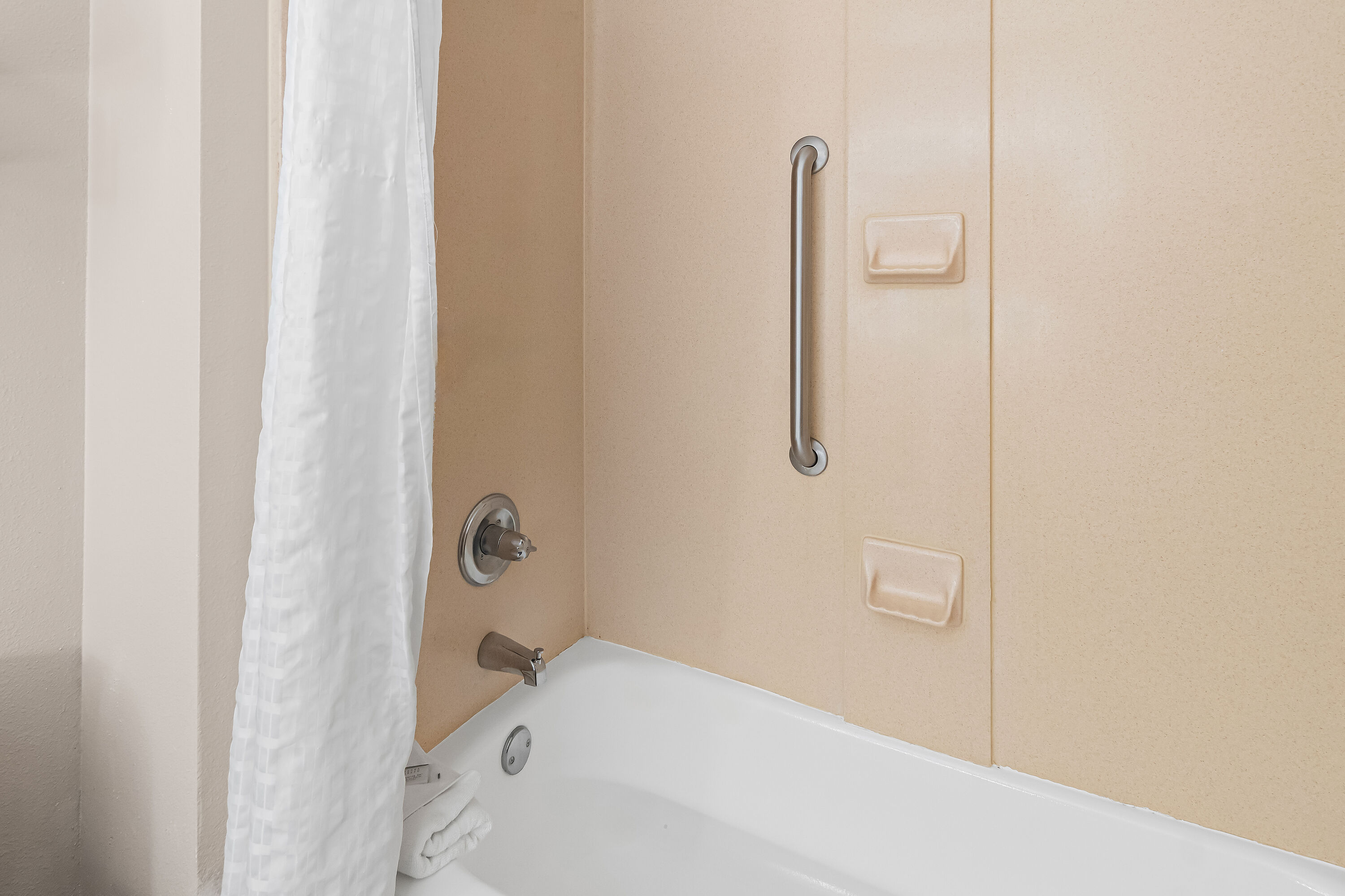 Guest room bath at the Super 8 by Wyndham Fort Worth Stockyards in Fort Worth, Texas