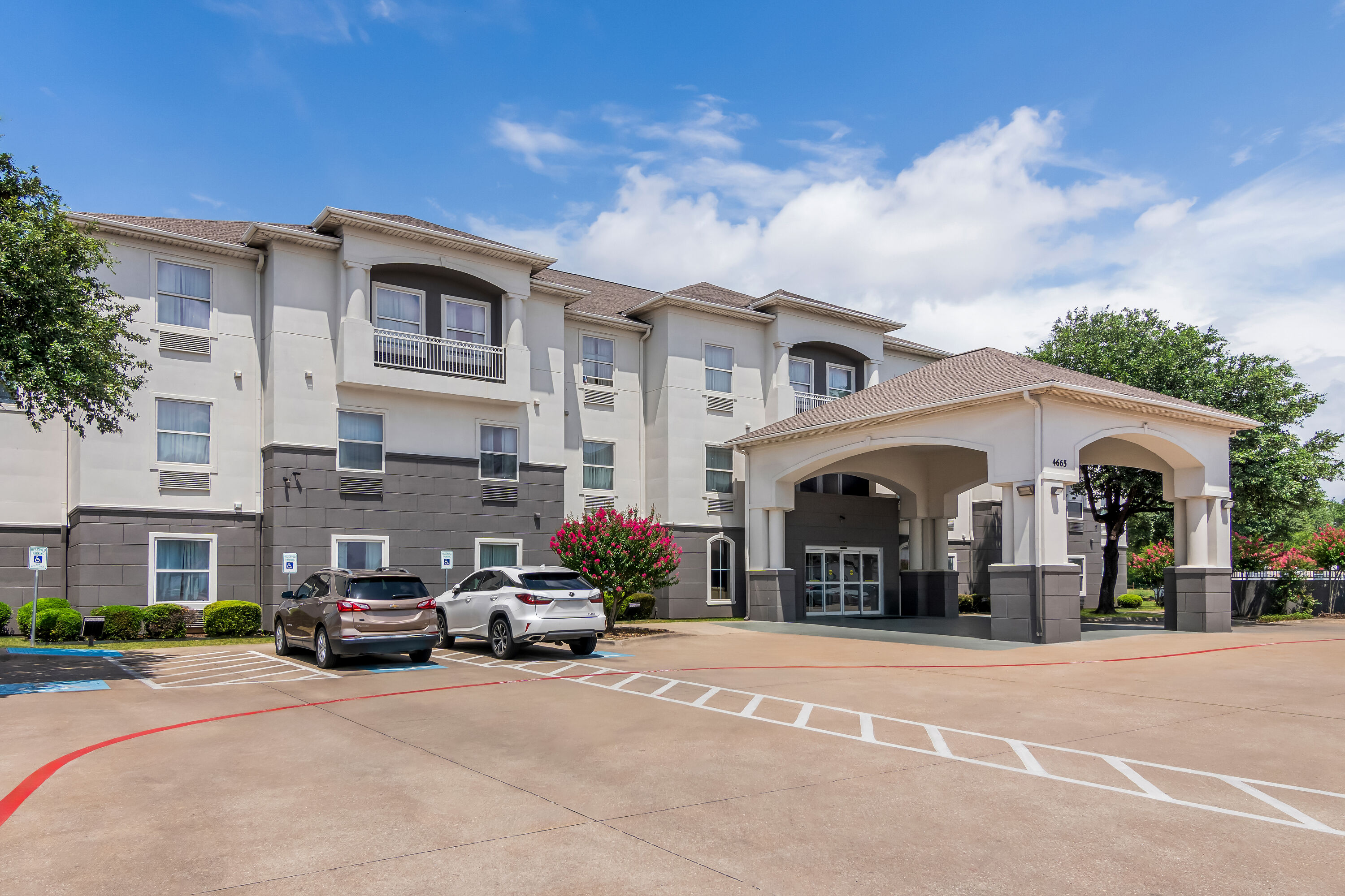 Exterior Day Image of Super 8 by Wyndham Fort Worth Stockyards hotel in Fort Worth, Texas