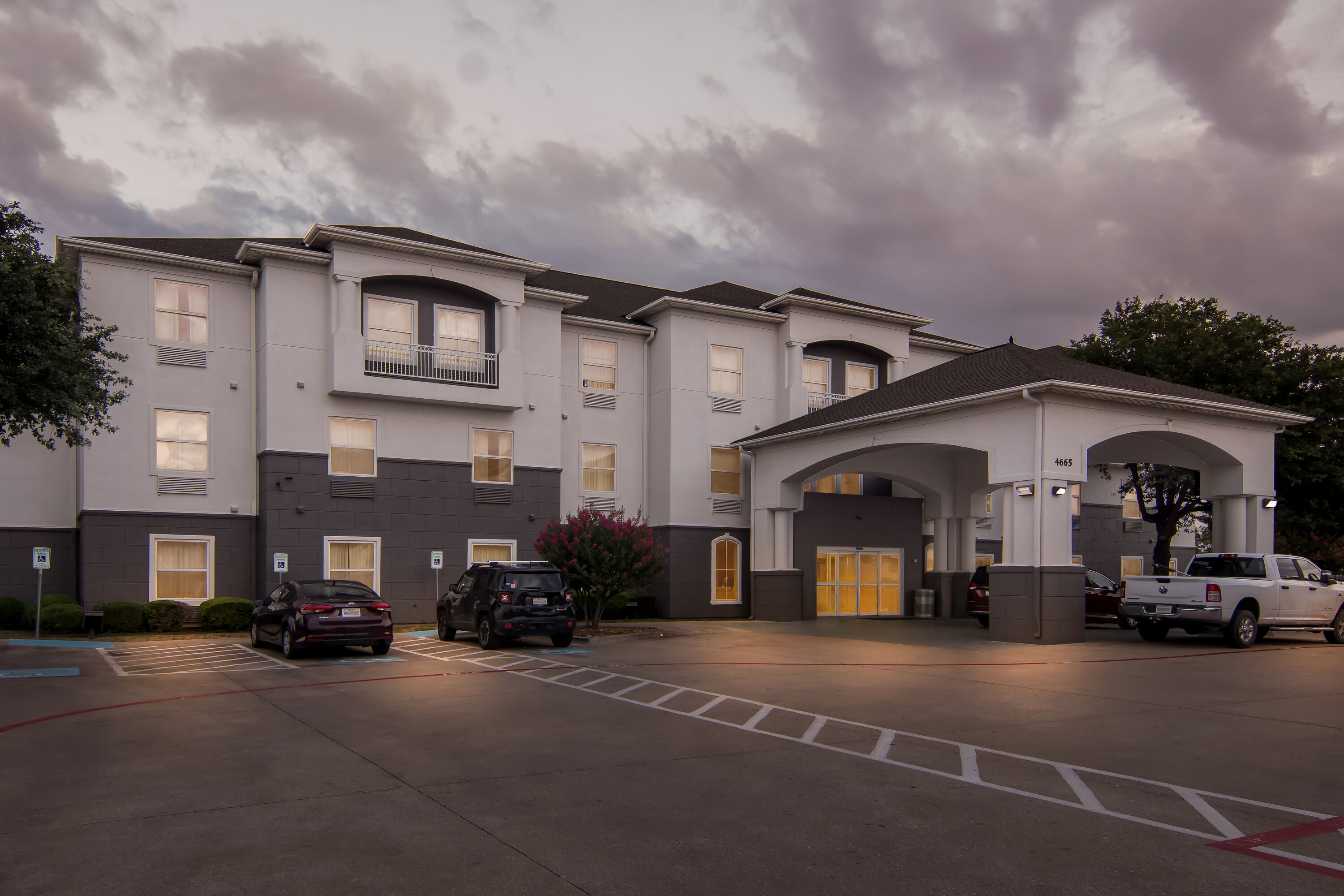 Exterior Night Image of Super 8 by Wyndham Fort Worth Stockyards hotel in Fort Worth, Texas