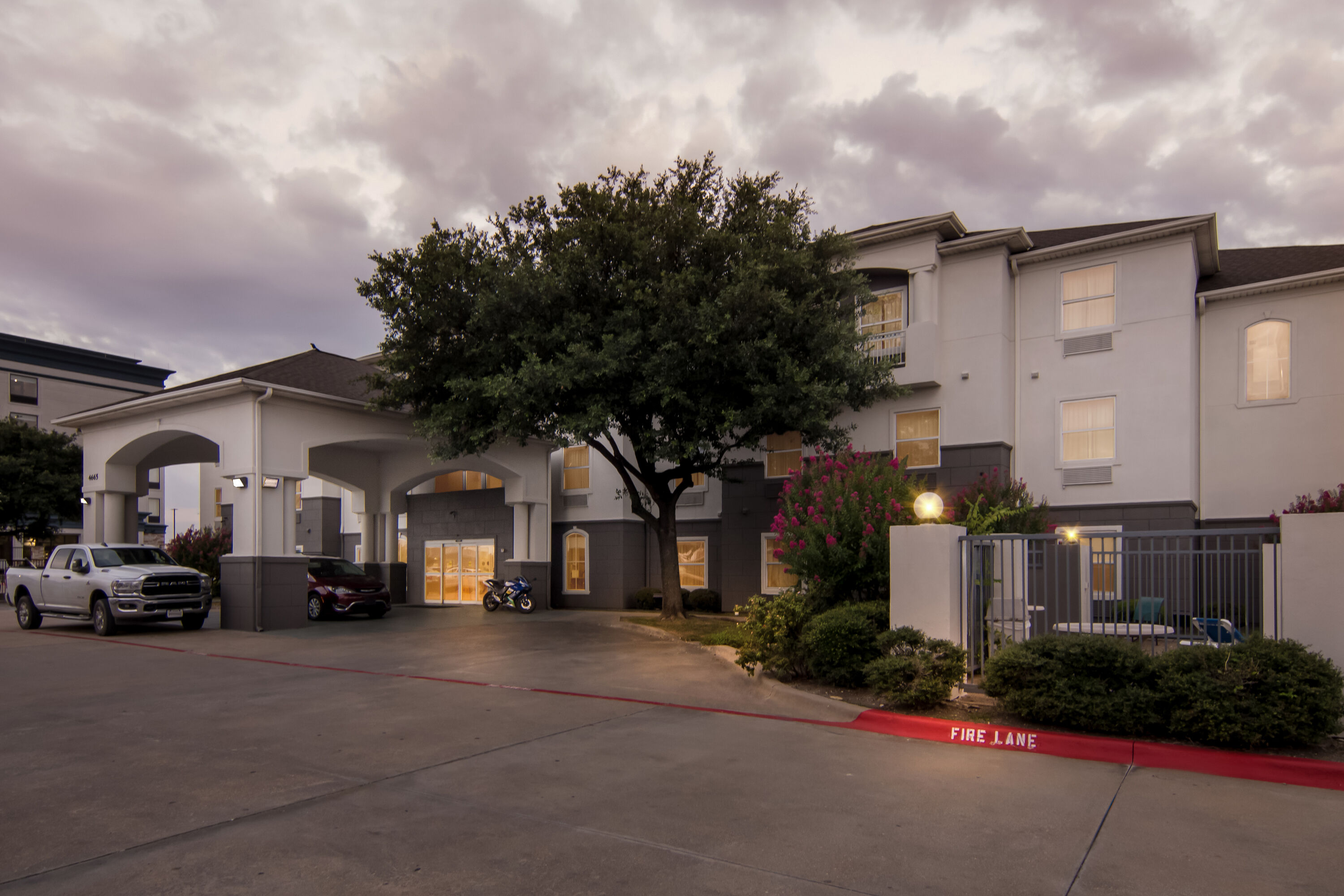 Exterior Night Image of Super 8 by Wyndham Fort Worth Stockyards hotel in Fort Worth, Texas