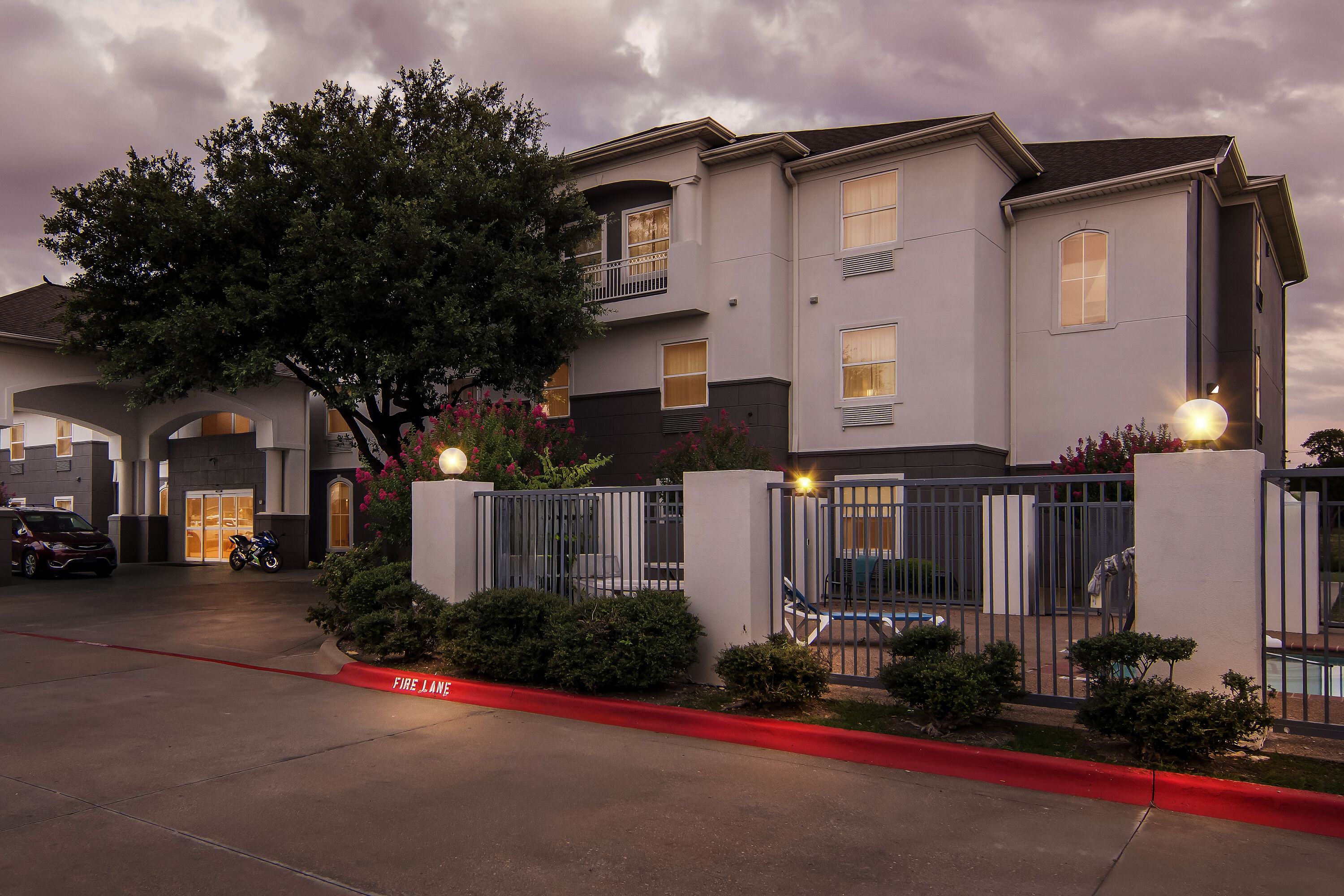 Exterior Night Image of Super 8 by Wyndham Fort Worth Stockyards hotel in Fort Worth, Texas