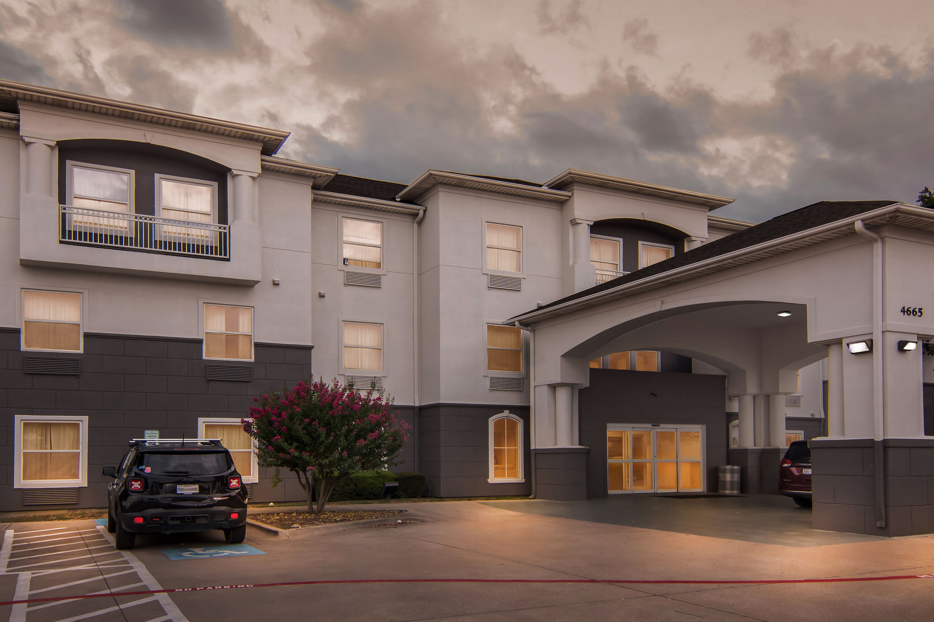 Exterior Night Image of Super 8 by Wyndham Fort Worth Stockyards hotel in Fort Worth, Texas