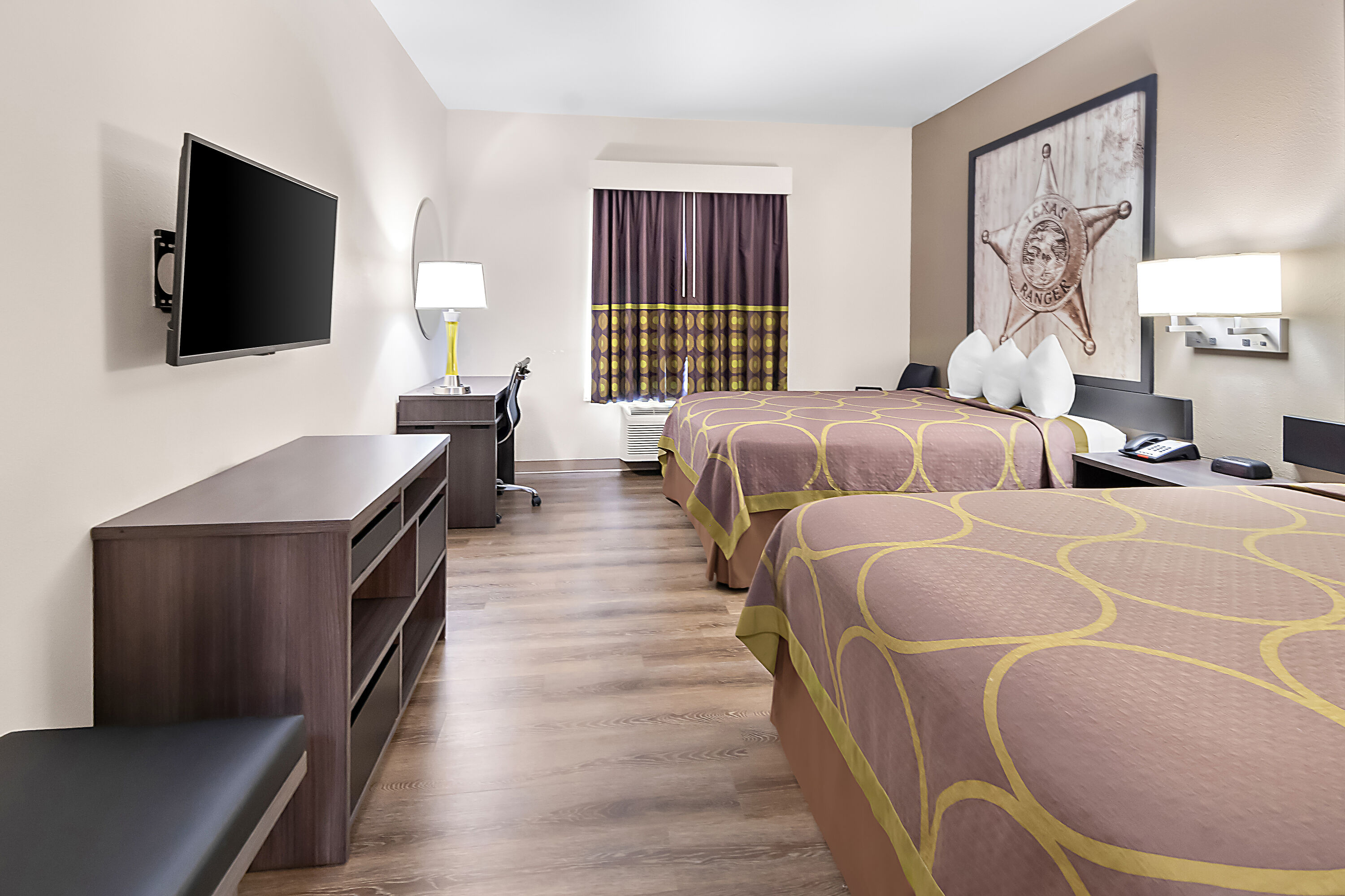 Double bed guest room at the Super 8 by Wyndham Fort Worth Stockyards in Fort Worth, Texas