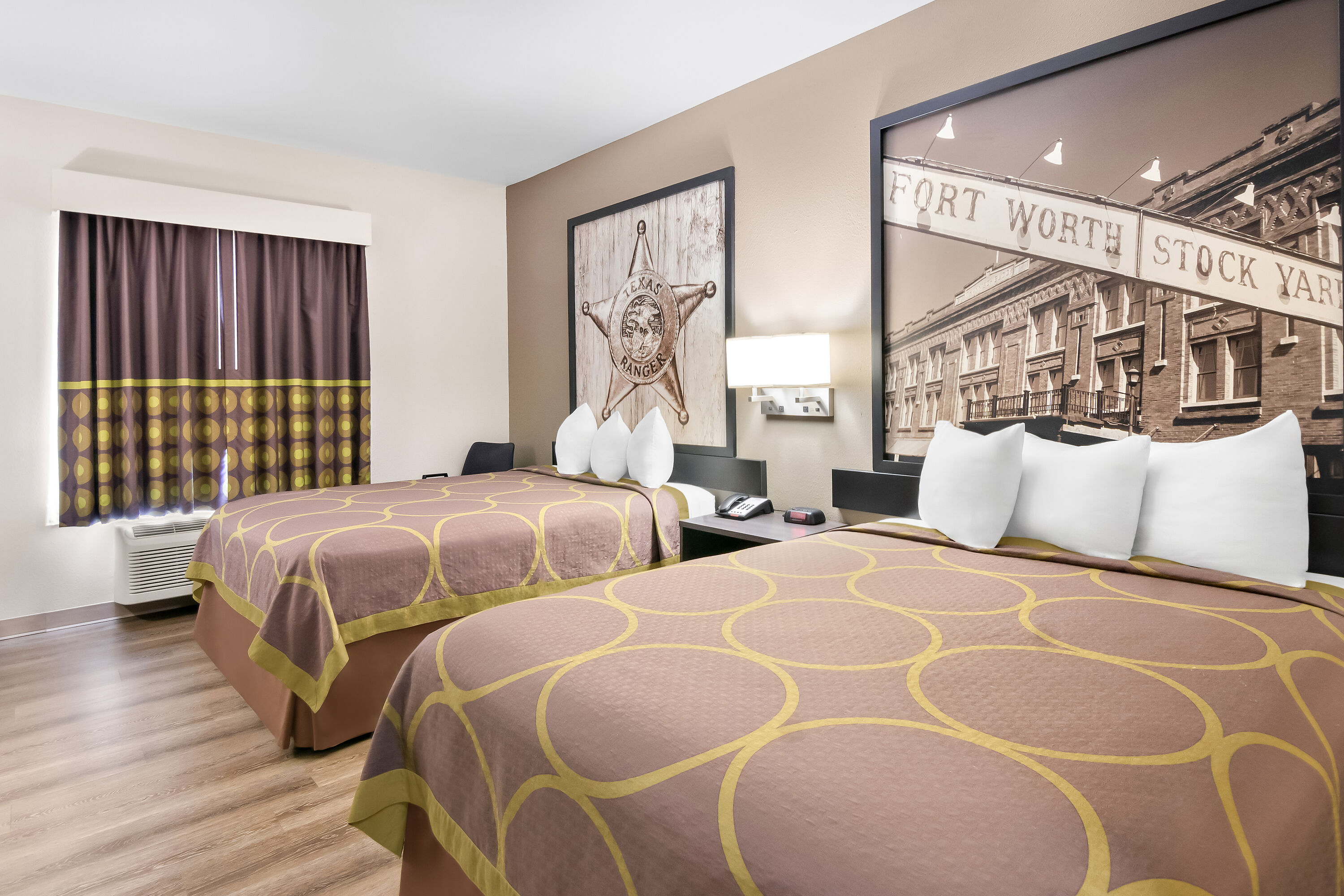 Double bed guest room at the Super 8 by Wyndham Fort Worth Stockyards in Fort Worth, Texas