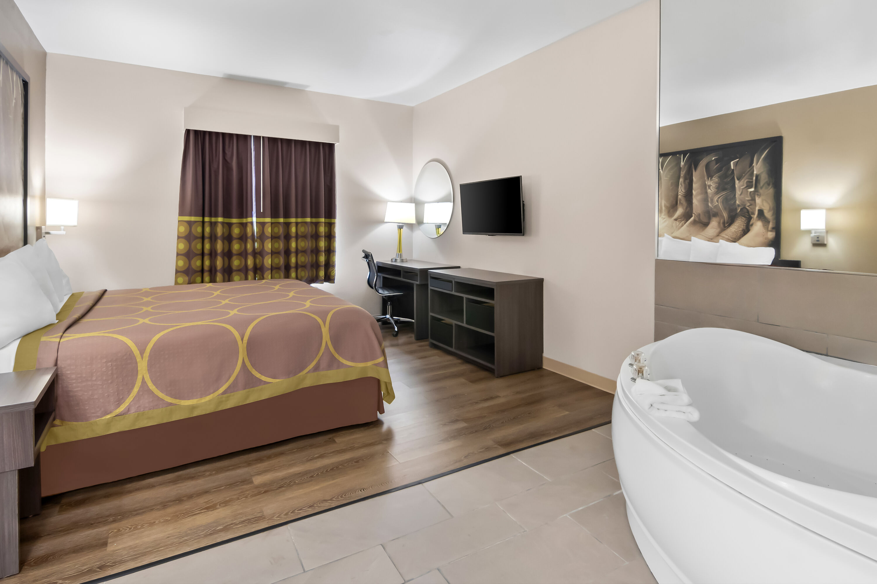 King bed guest room at the Super 8 by Wyndham Fort Worth Stockyards in Fort Worth, Texas