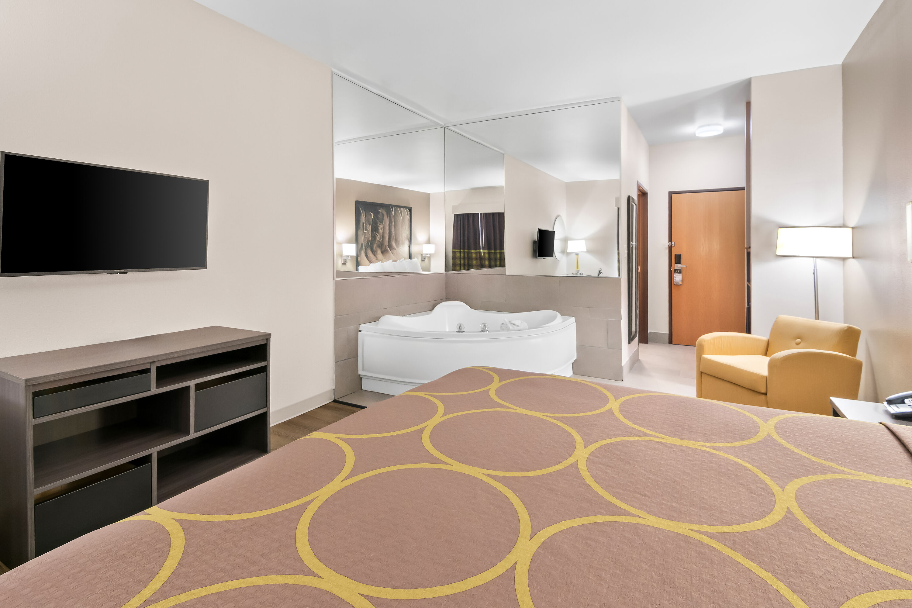 King bed guest room at the Super 8 by Wyndham Fort Worth Stockyards in Fort Worth, Texas