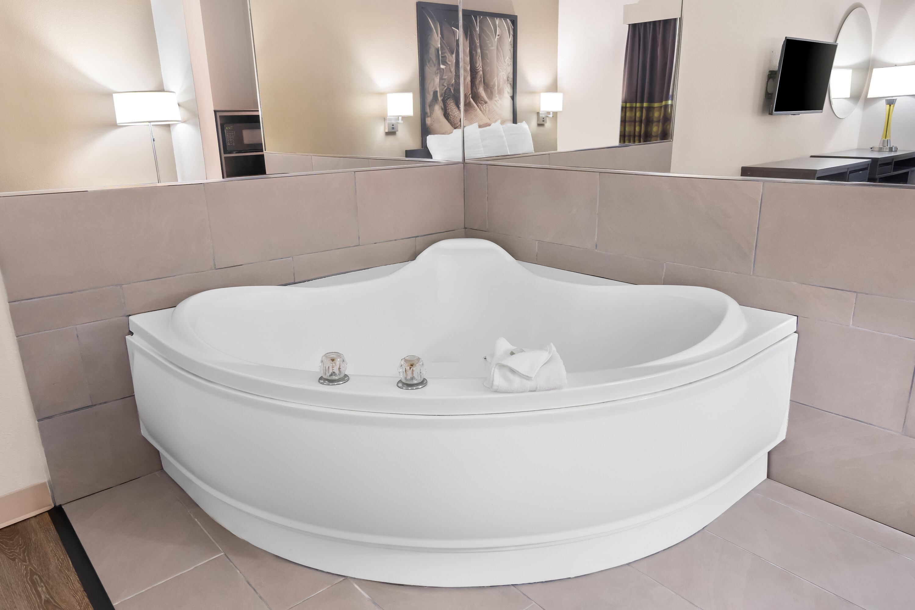 King bed guest room at the Super 8 by Wyndham Fort Worth Stockyards in Fort Worth, Texas