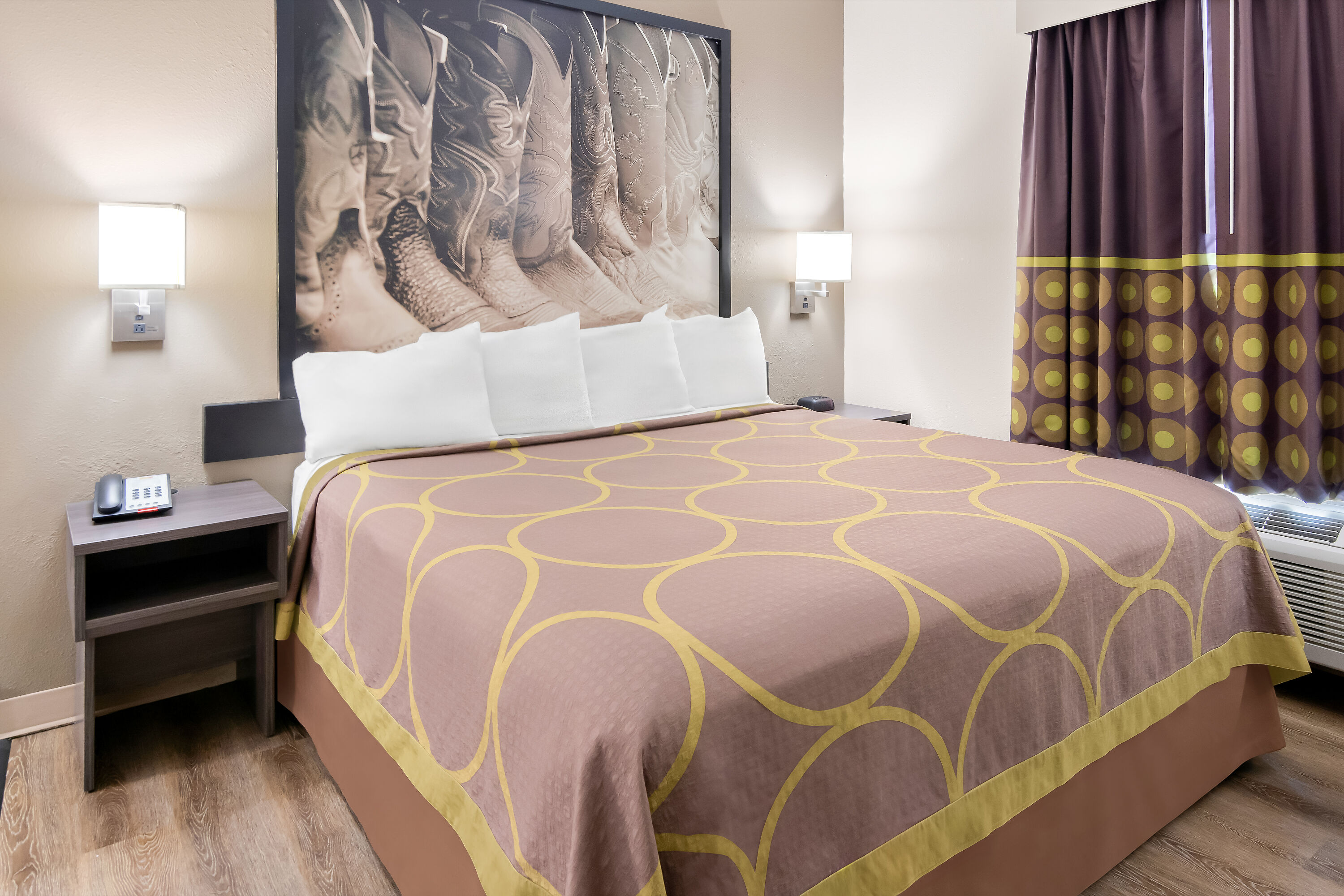 King bed guest room at the Super 8 by Wyndham Fort Worth Stockyards in Fort Worth, Texas