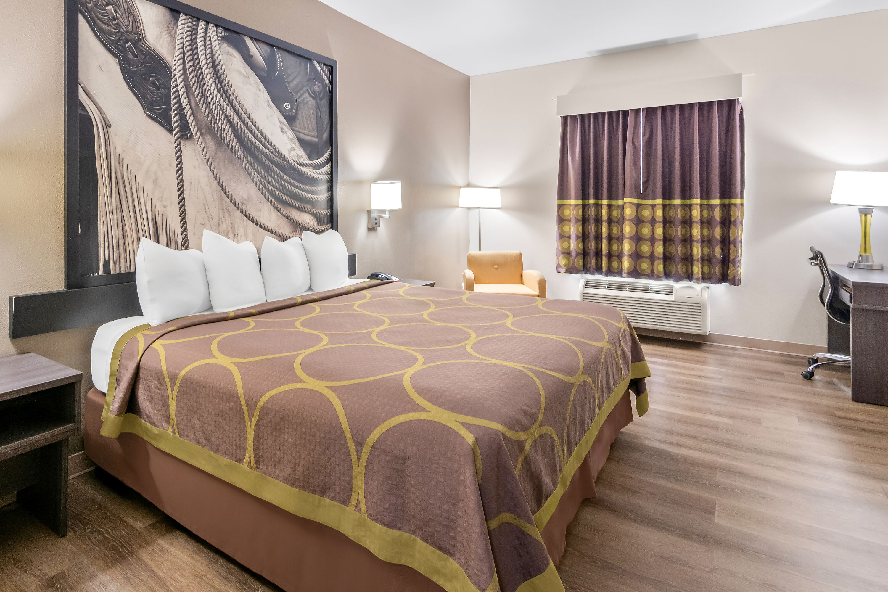 King bed guest room at the Super 8 by Wyndham Fort Worth Stockyards in Fort Worth, Texas