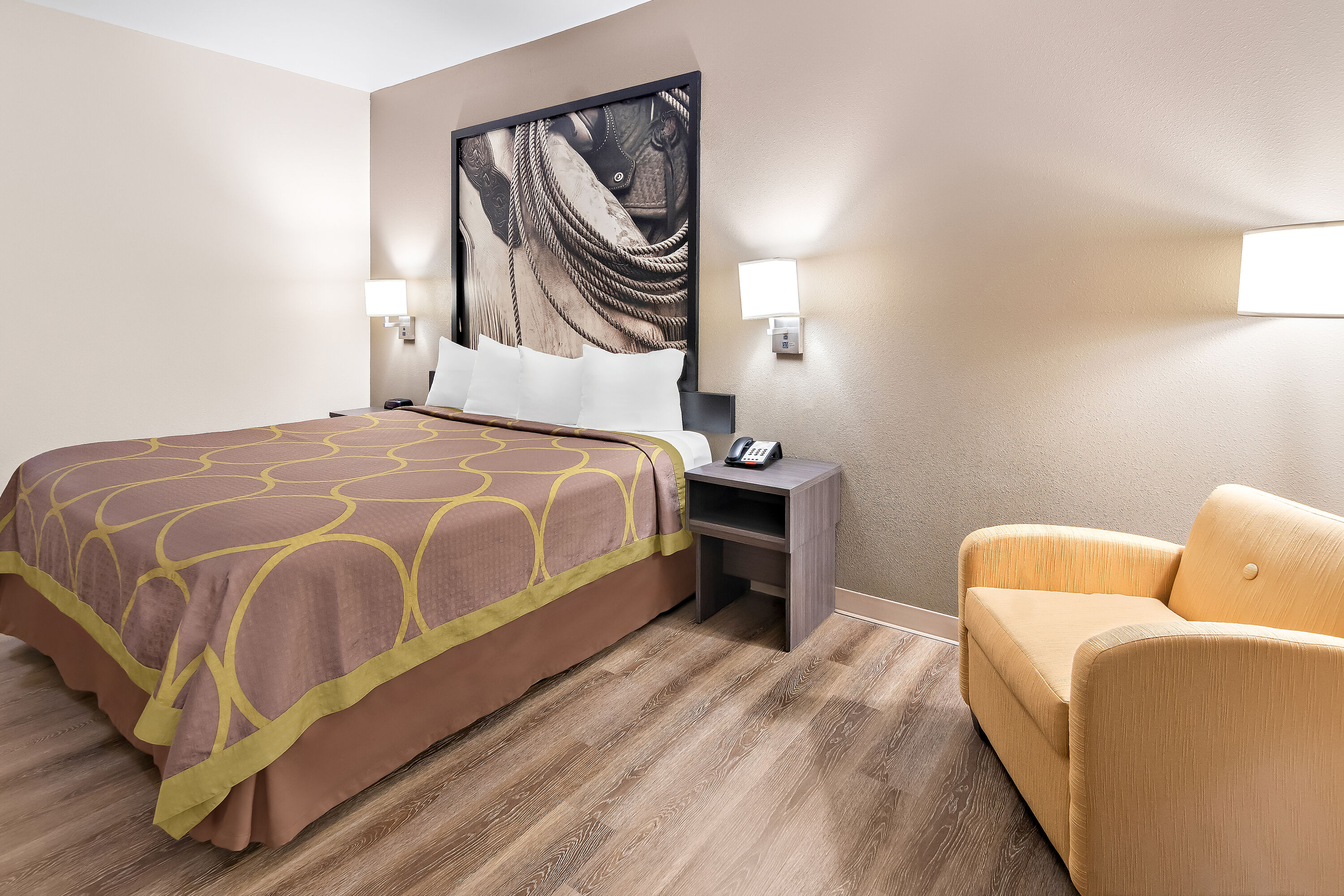 King bed guest room at the Super 8 by Wyndham Fort Worth Stockyards in Fort Worth, Texas