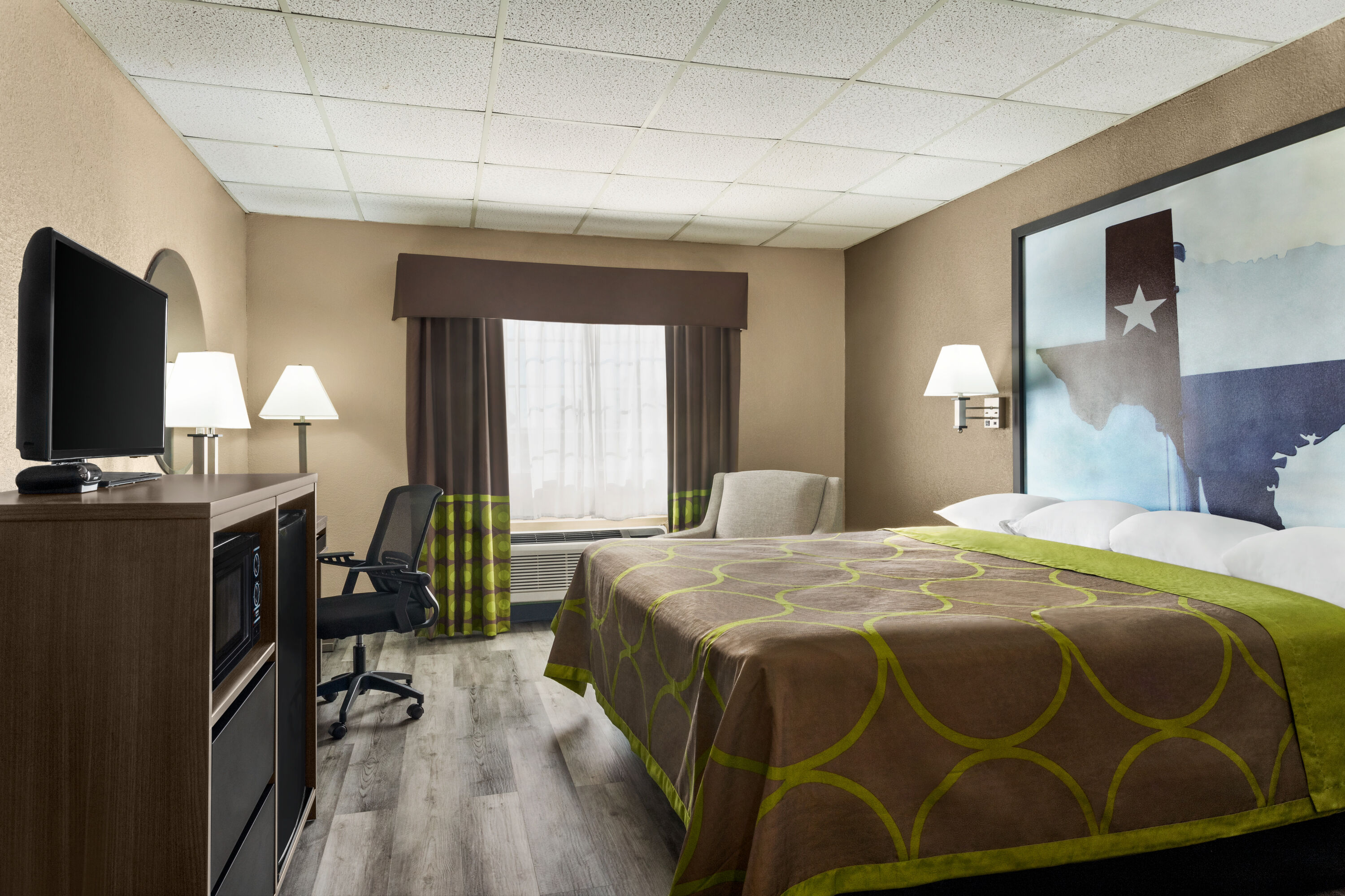 Guest room at the Super 8 by Wyndham Gainesville TX in Gainesville, Texas