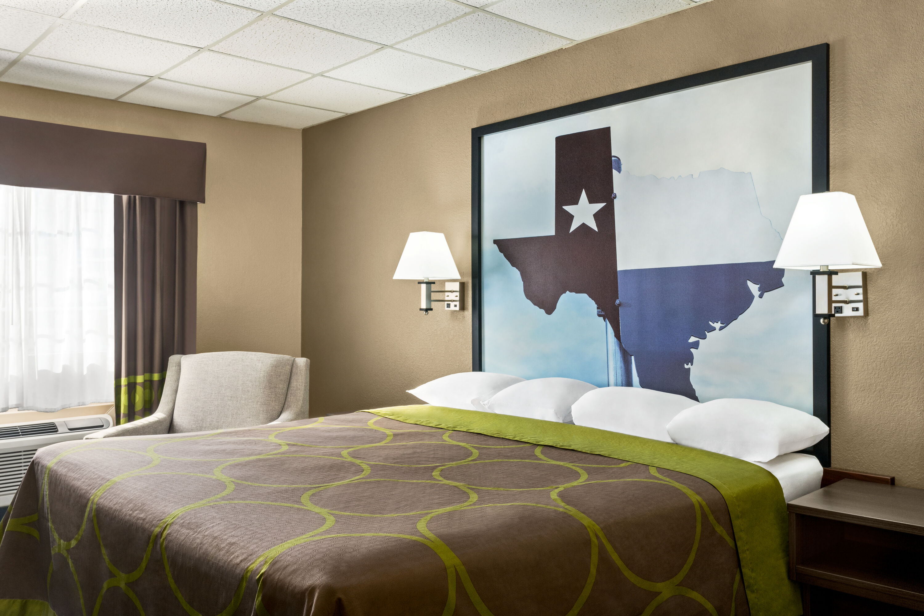 Guest room at the Super 8 by Wyndham Gainesville TX in Gainesville, Texas