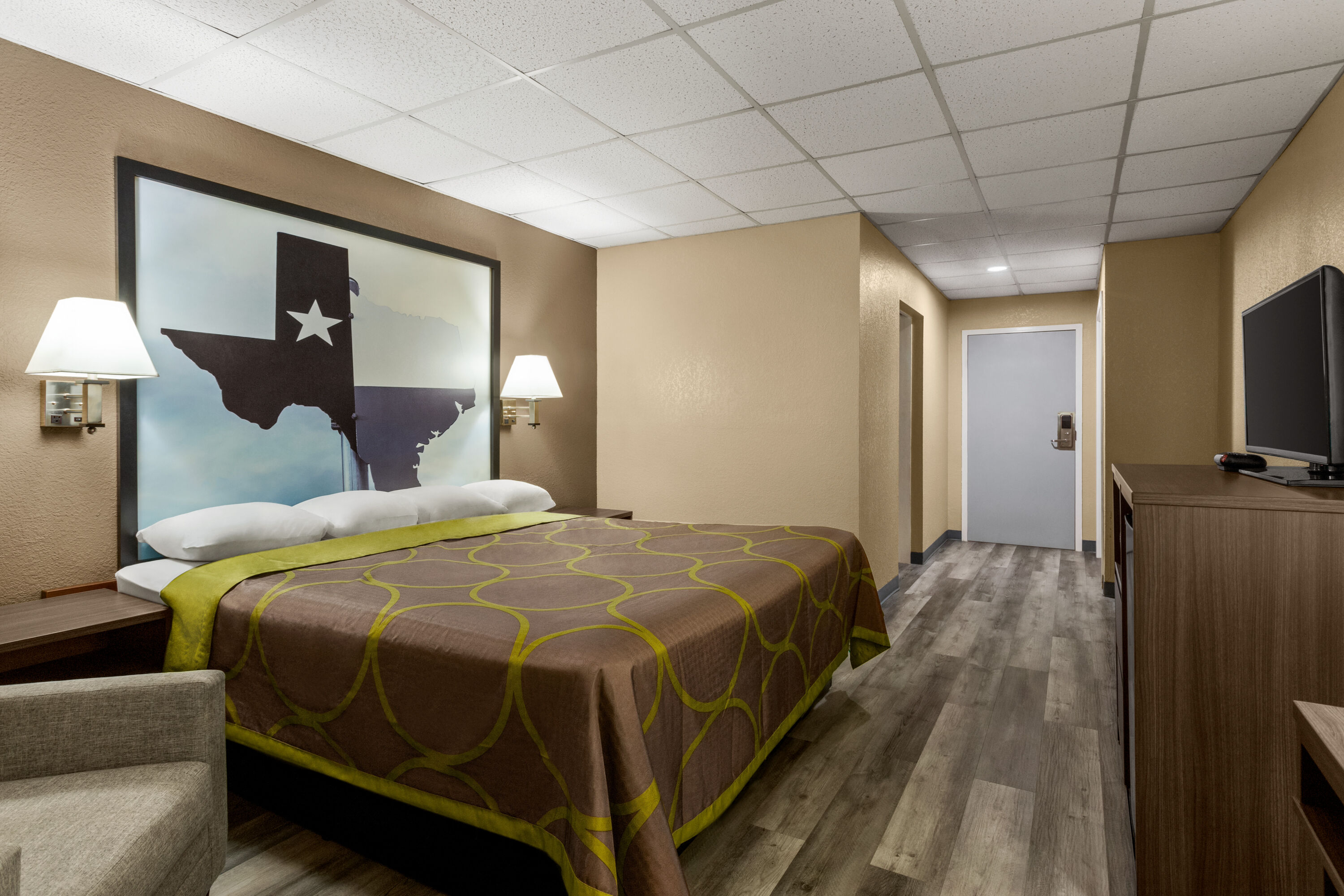 Guest room at the Super 8 by Wyndham Gainesville TX in Gainesville, Texas