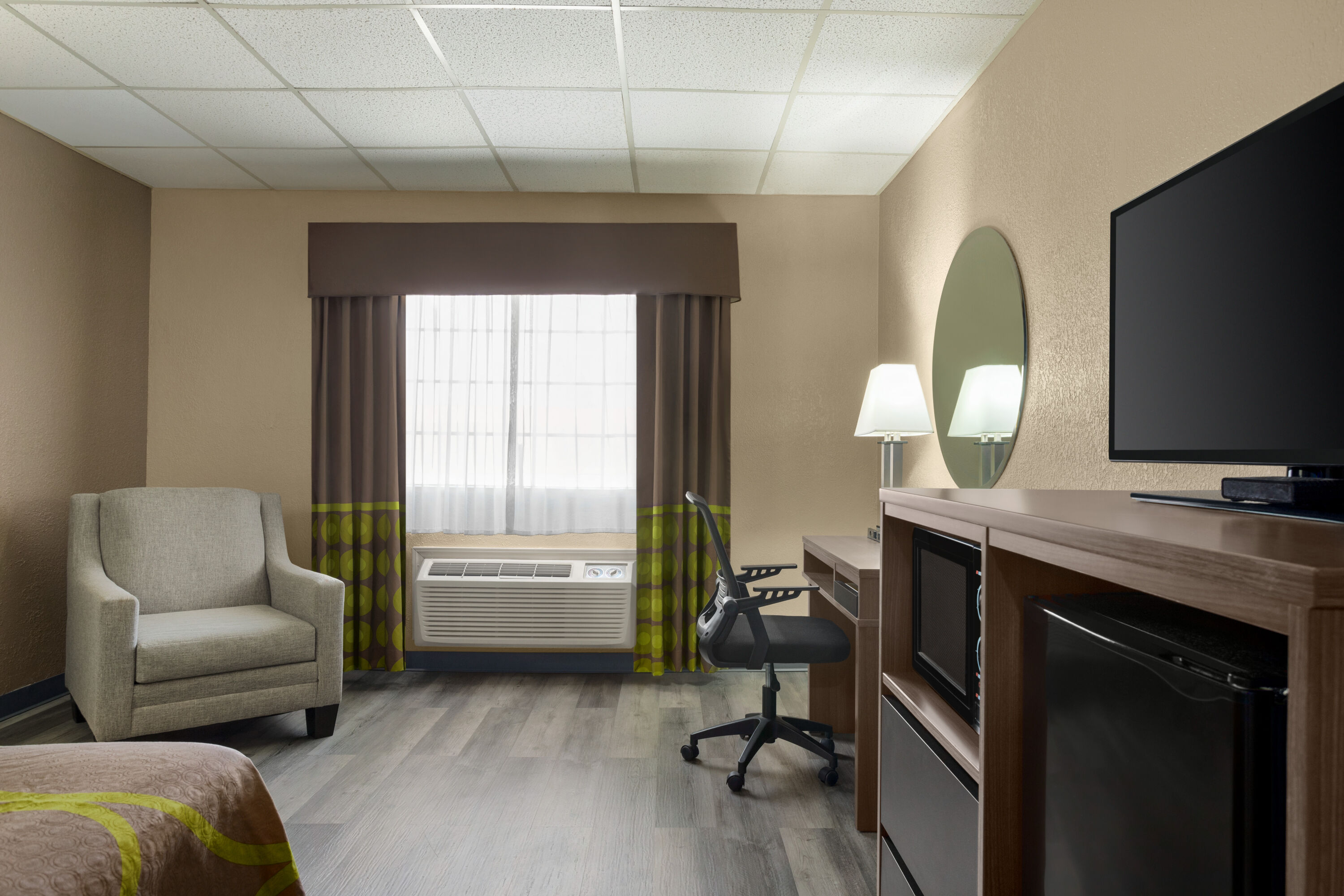 Guest room at the Super 8 by Wyndham Gainesville TX in Gainesville, Texas