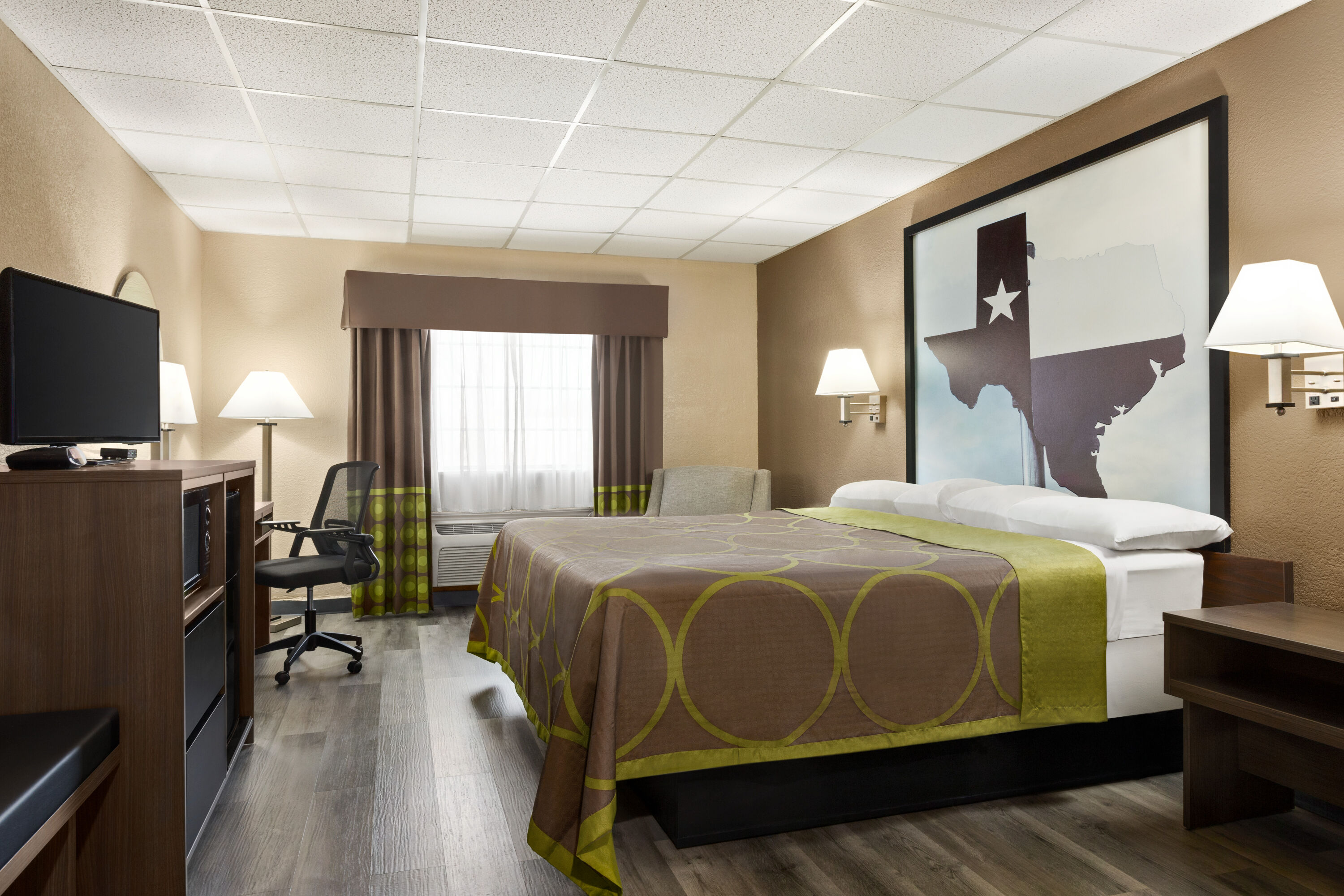 Guest room at the Super 8 by Wyndham Gainesville TX in Gainesville, Texas