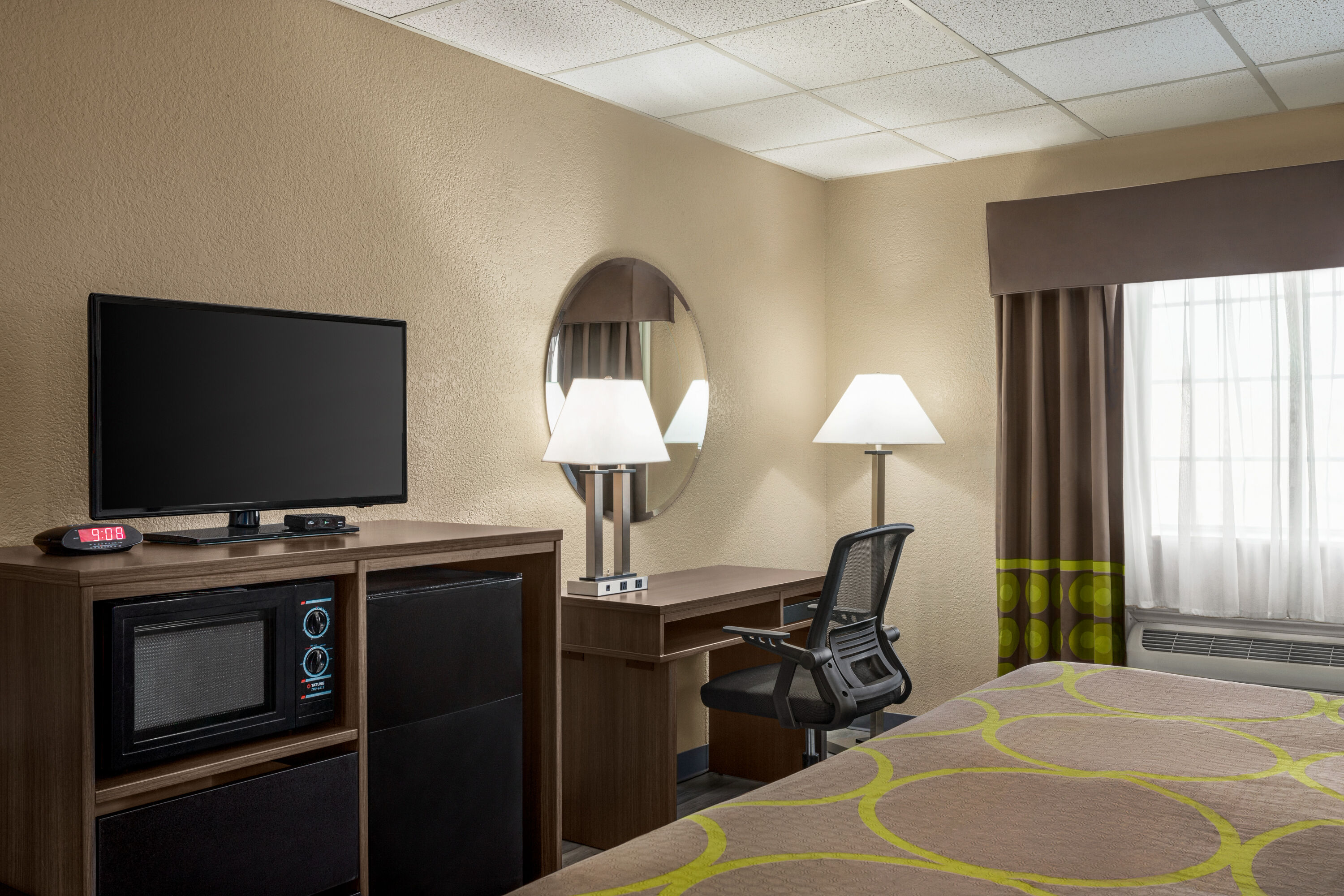 Guest room at the Super 8 by Wyndham Gainesville TX in Gainesville, Texas