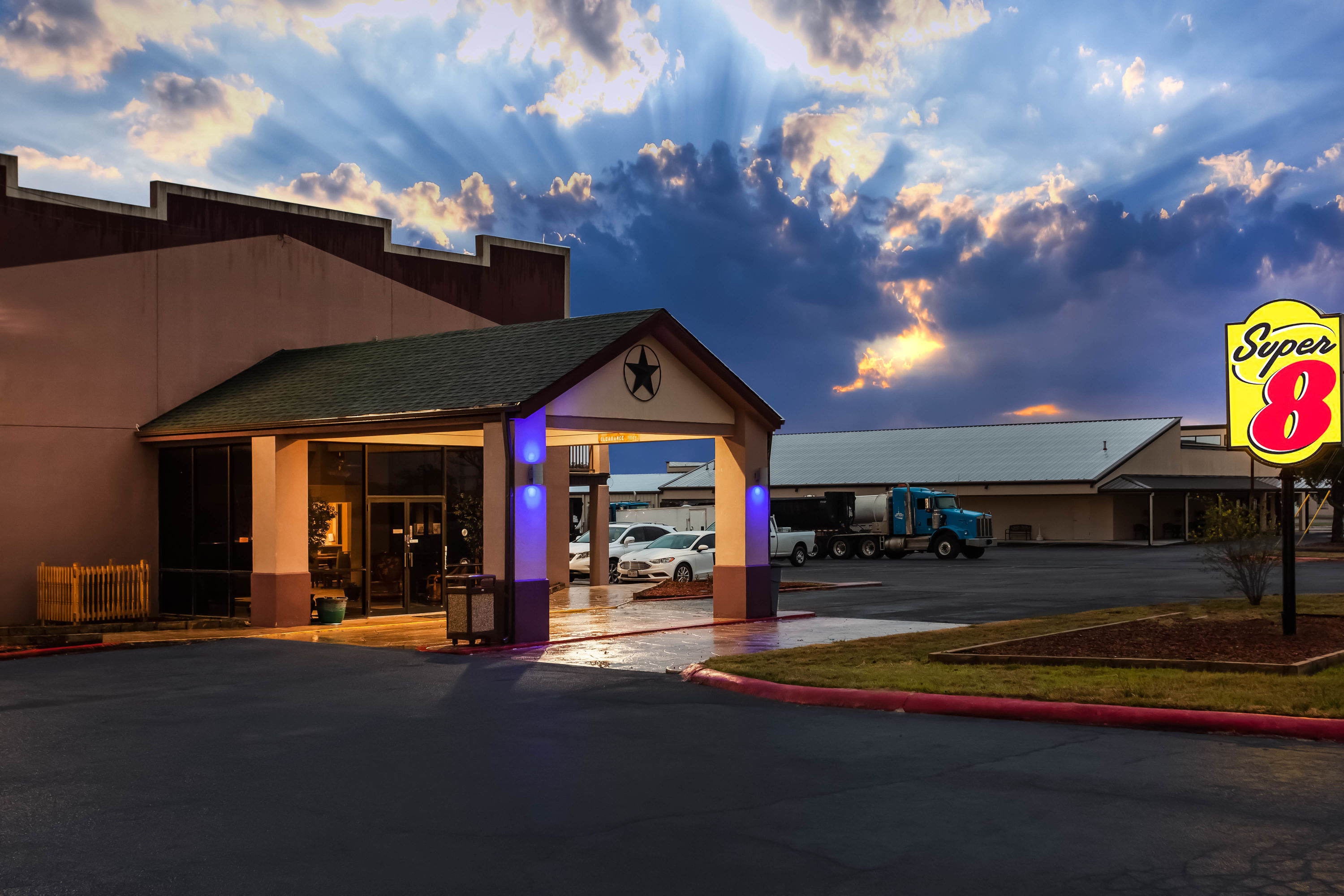 Exterior Dusk Image of Super 8 by Wyndham Giddings hotel in Giddings, Texas
